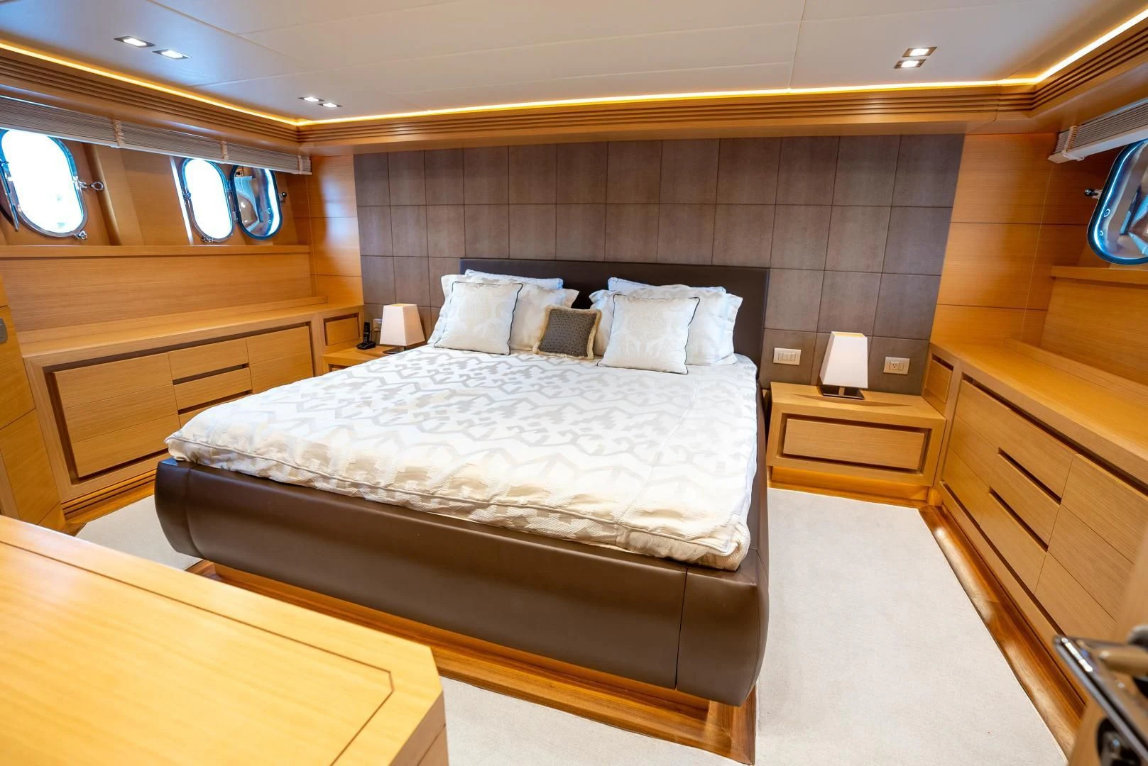 a room with a bed and a desk aboard NEVER REST Yacht for Sale