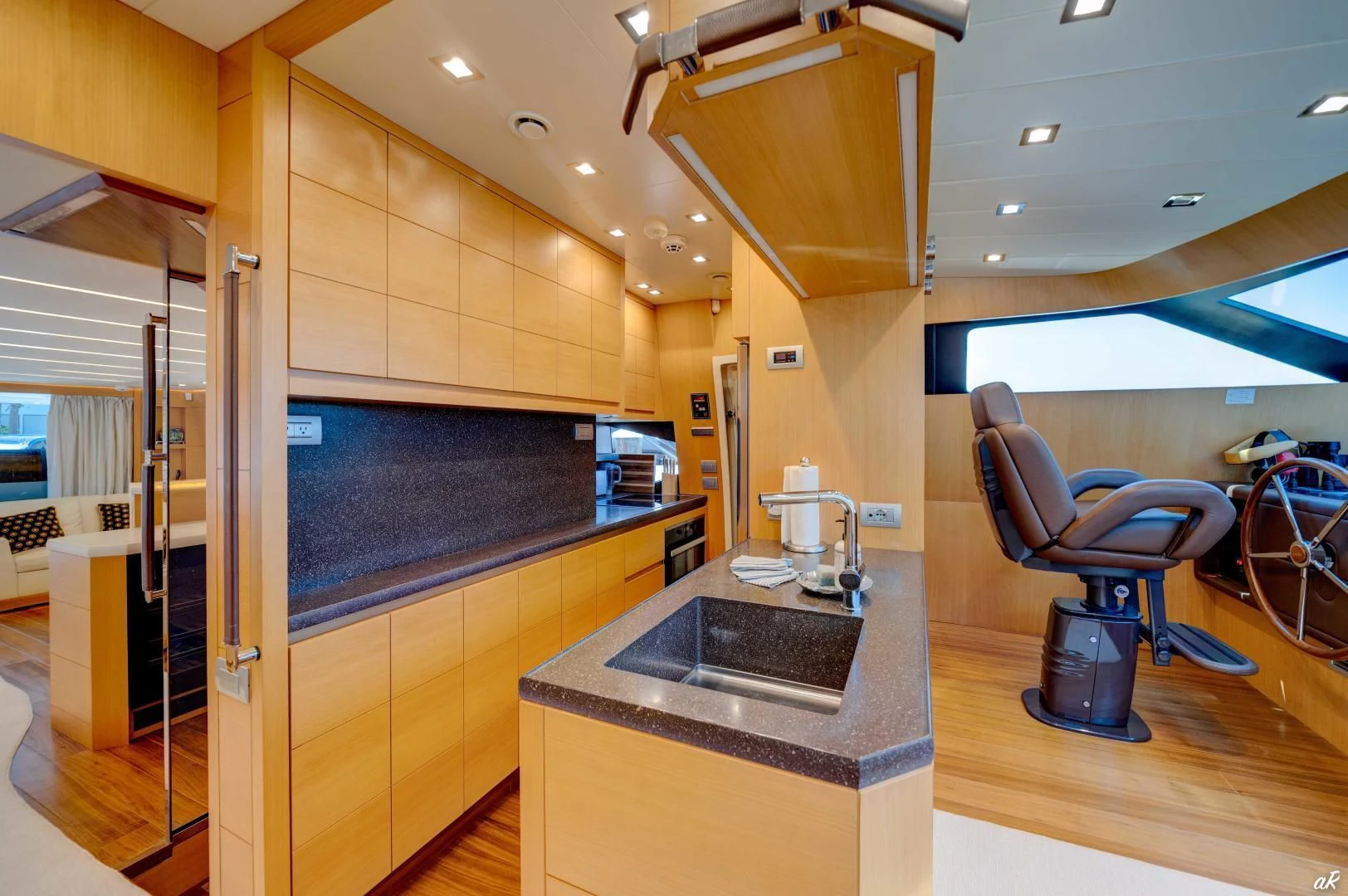a kitchen with a sink and a microwave aboard NEVER REST Yacht for Sale