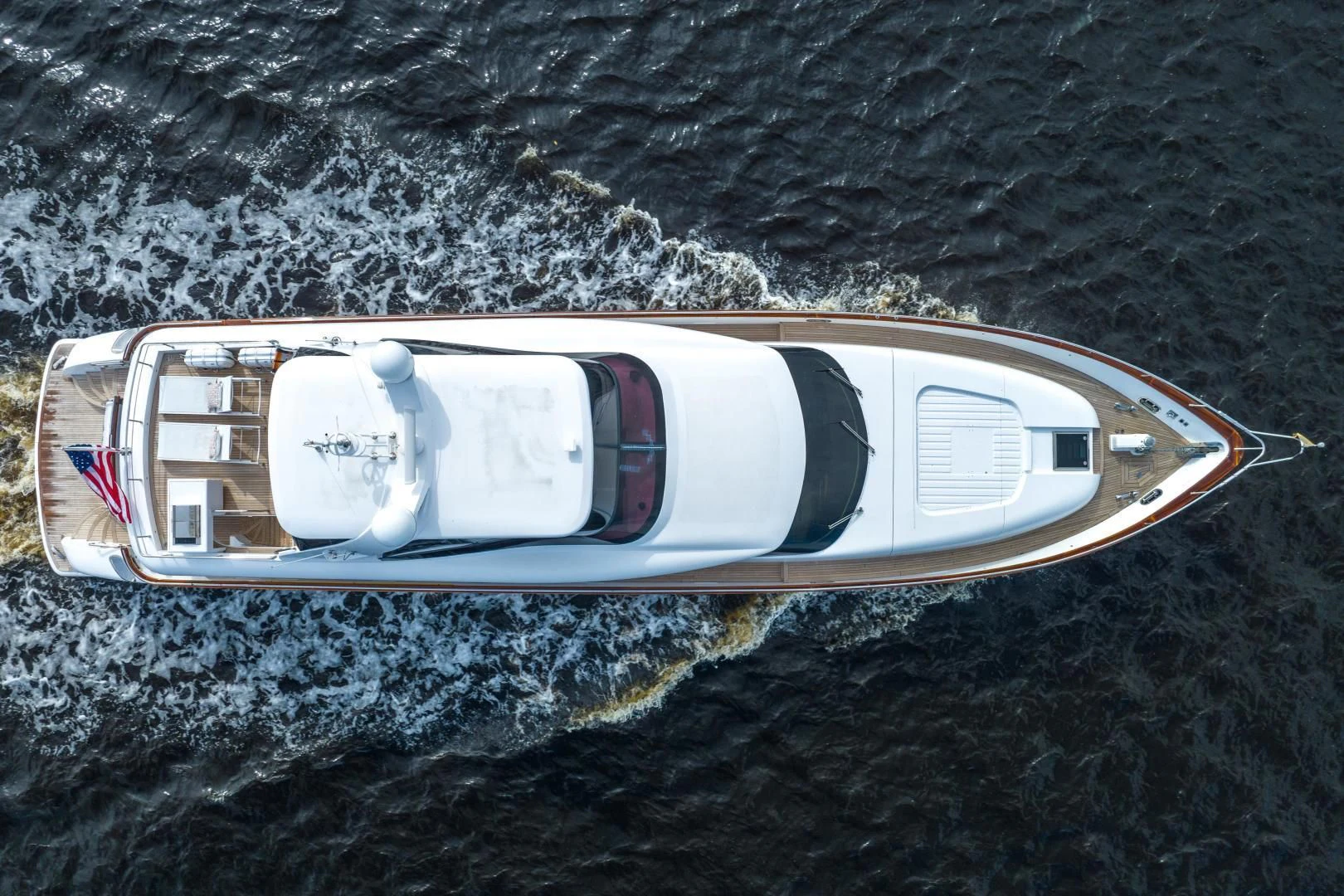 a white car on a dirt road aboard NEVER REST Yacht for Sale