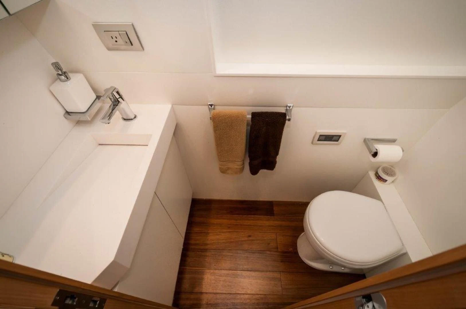 a bathroom with a toilet and sink aboard NEVER REST Yacht for Sale