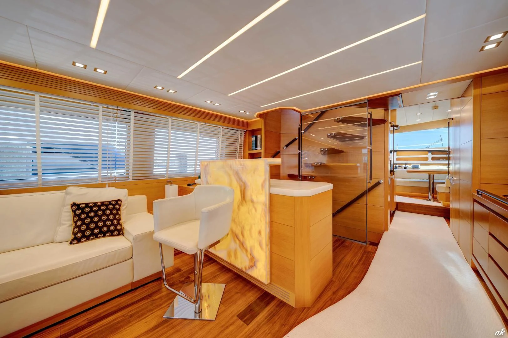 a room with a couch and a table aboard NEVER REST Yacht for Sale