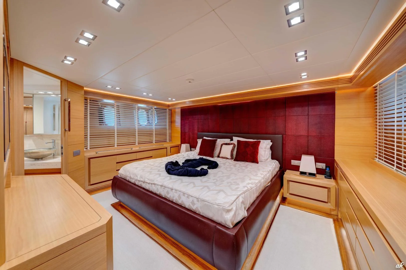 a room with a bed and a desk aboard NEVER REST Yacht for Sale