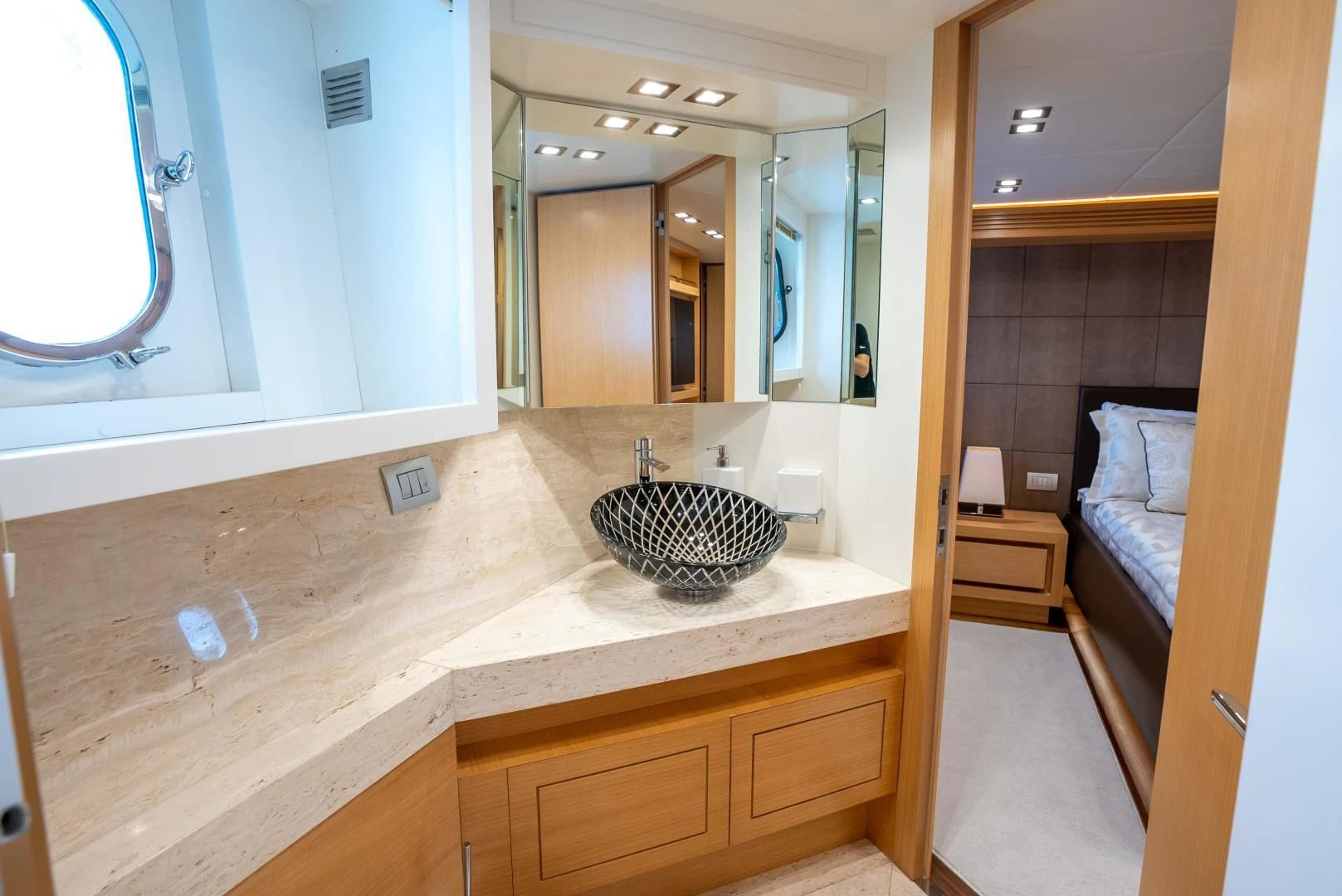 a bathroom with a large mirror aboard NEVER REST Yacht for Sale