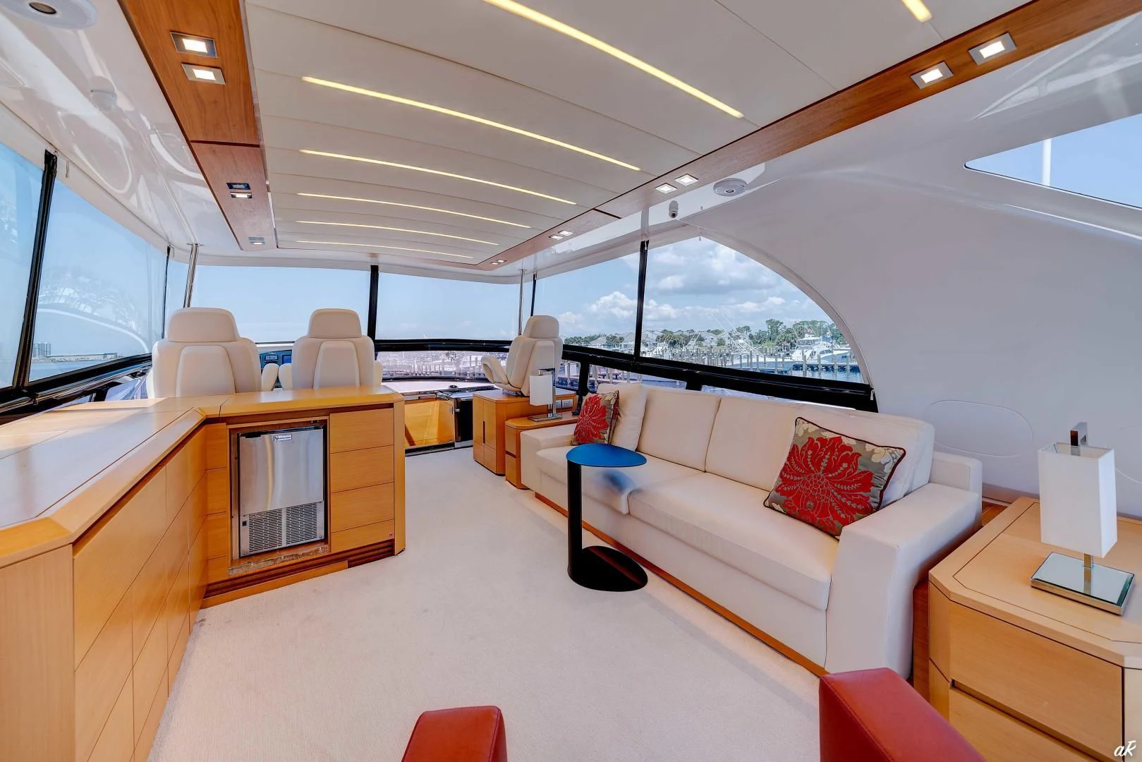 a room with a couch and a table and a tv aboard NEVER REST Yacht for Sale