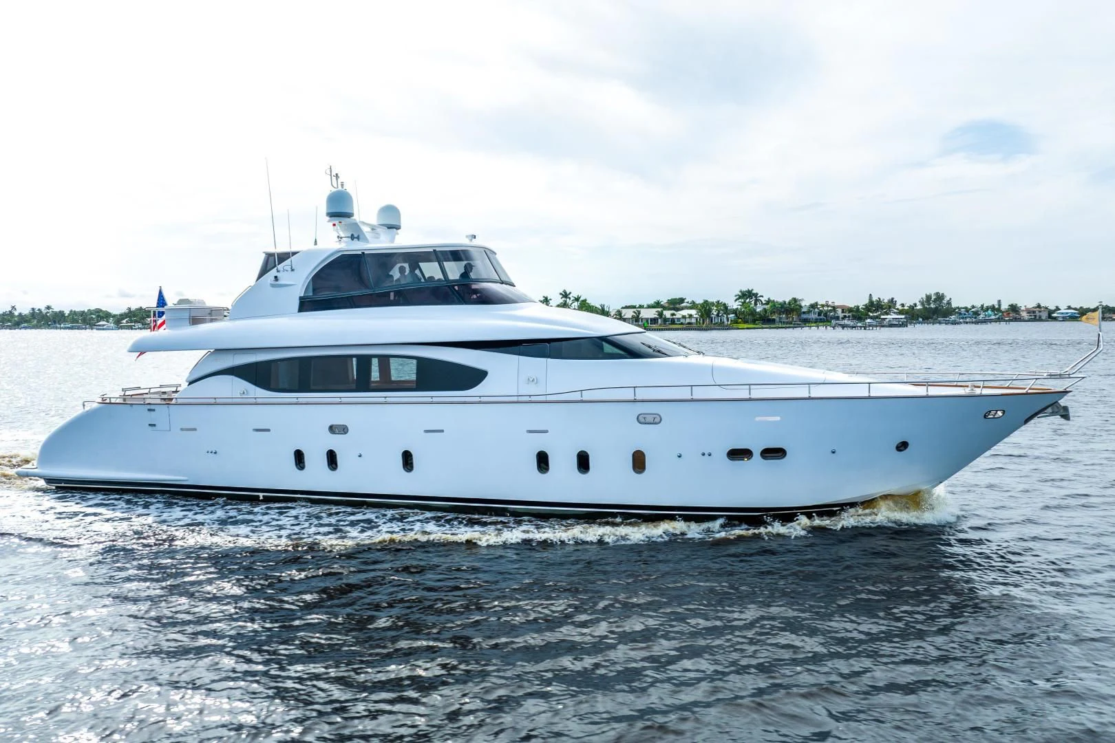 a white yacht on the water aboard NEVER REST Yacht for Sale