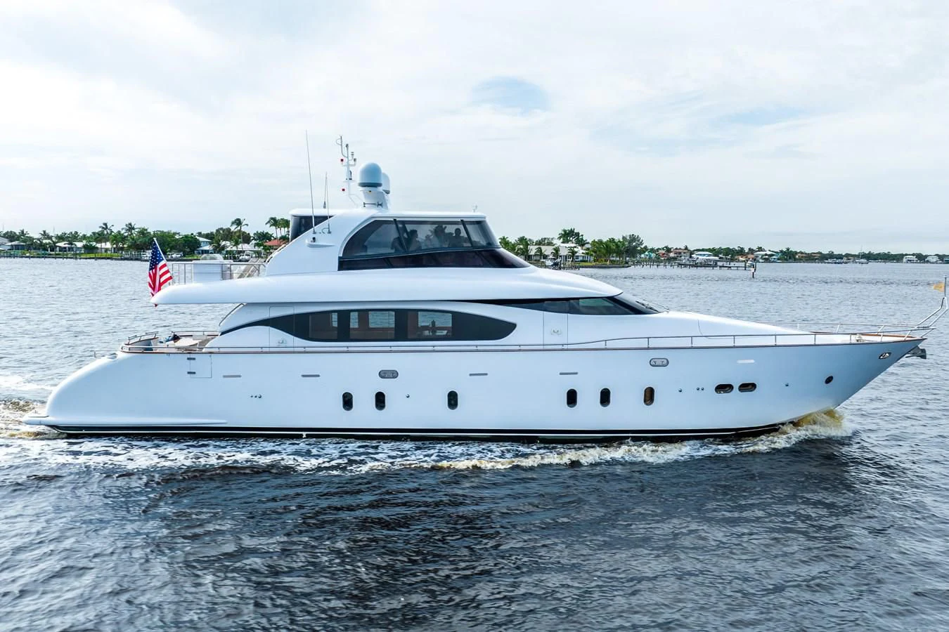 a white yacht on the water aboard NEVER REST Yacht for Sale
