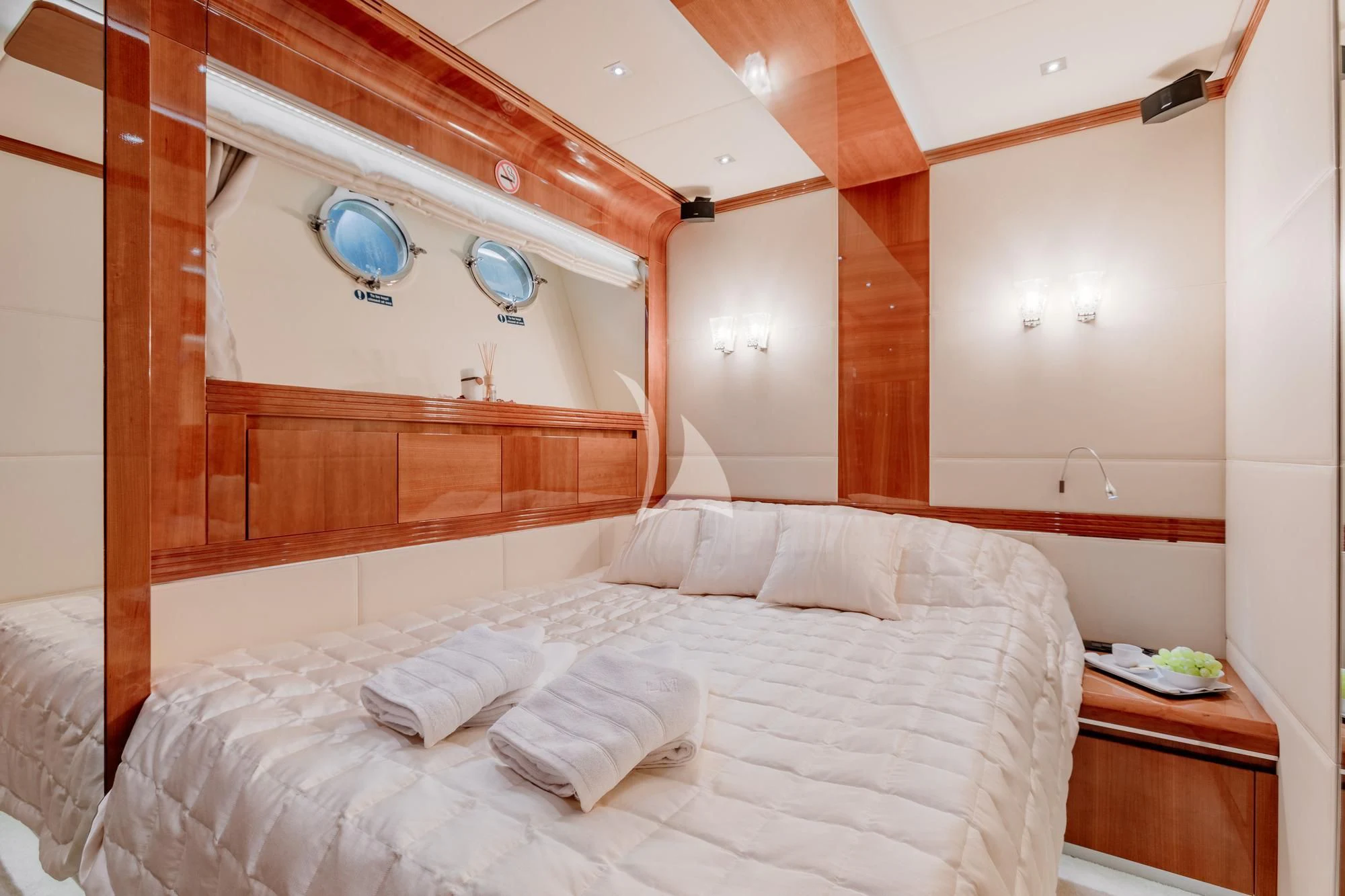 a bed with white sheets aboard LADY MURA Yacht for Sale