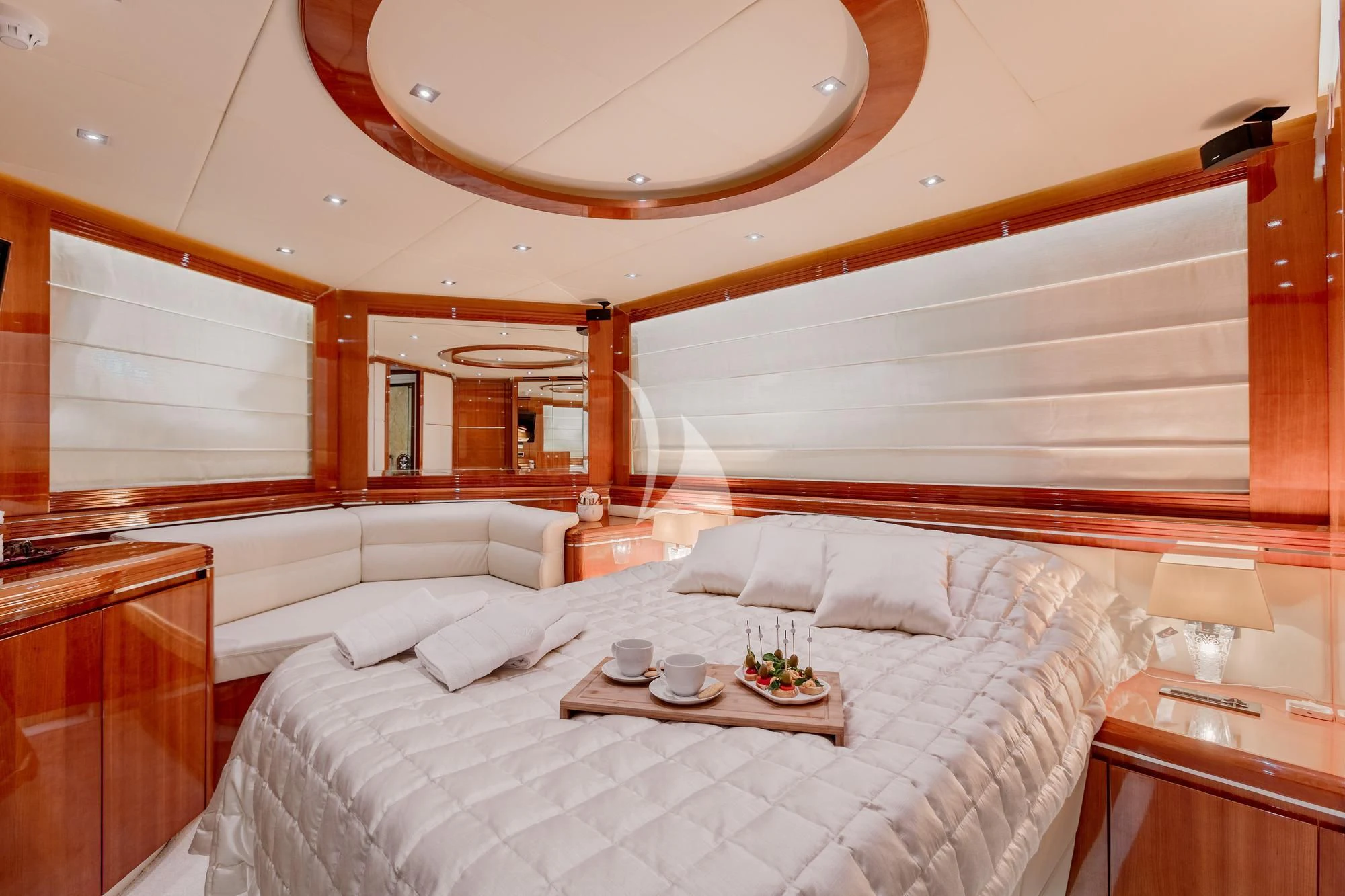 a room with a bed and a table aboard LADY MURA Yacht for Sale