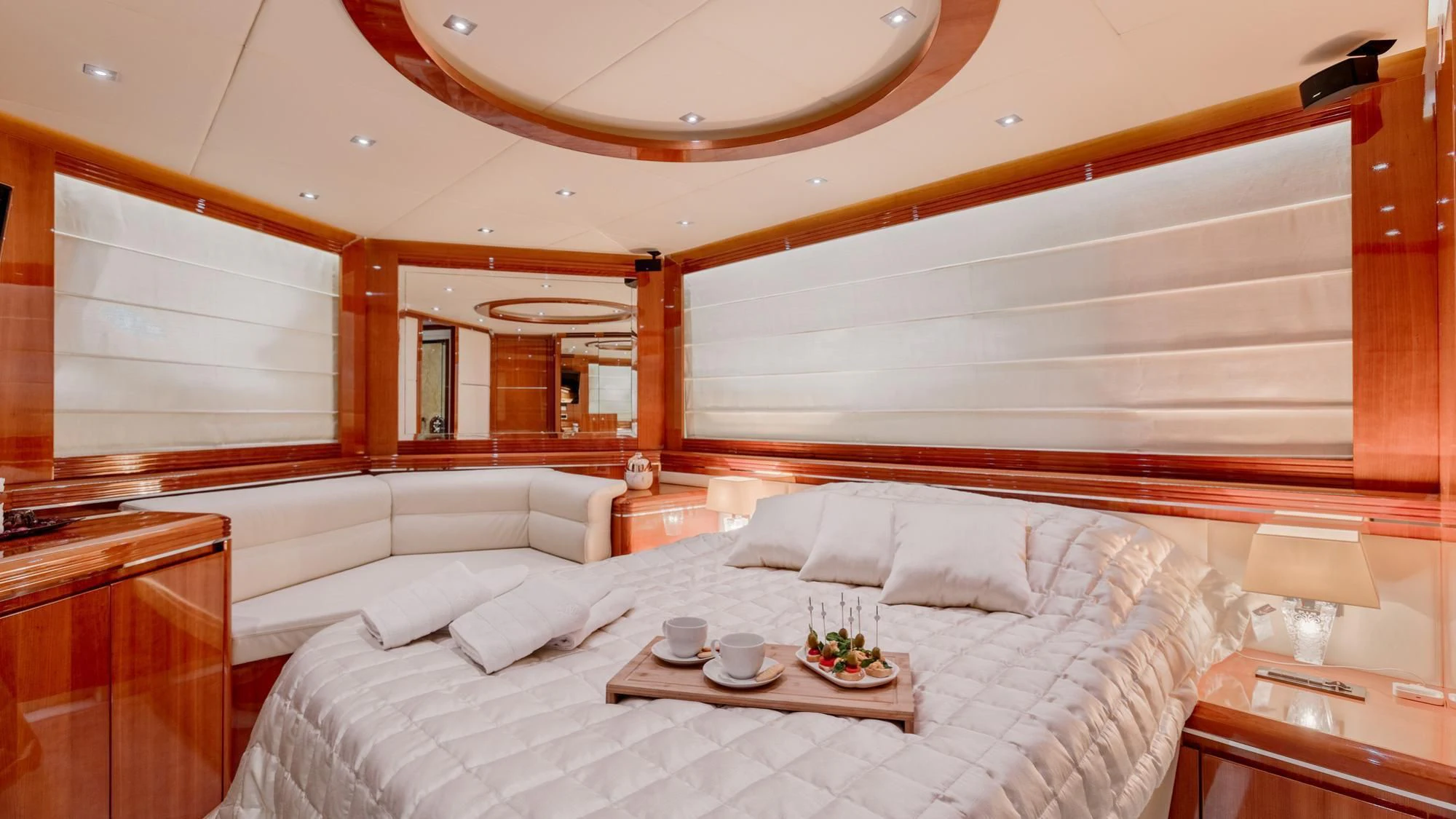 a large bed with a white bed aboard LADY MURA Yacht for Sale