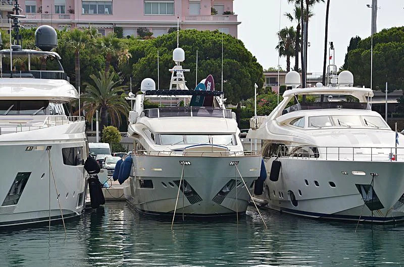 several boats docked at a pier aboard LADY MURA Yacht for Sale