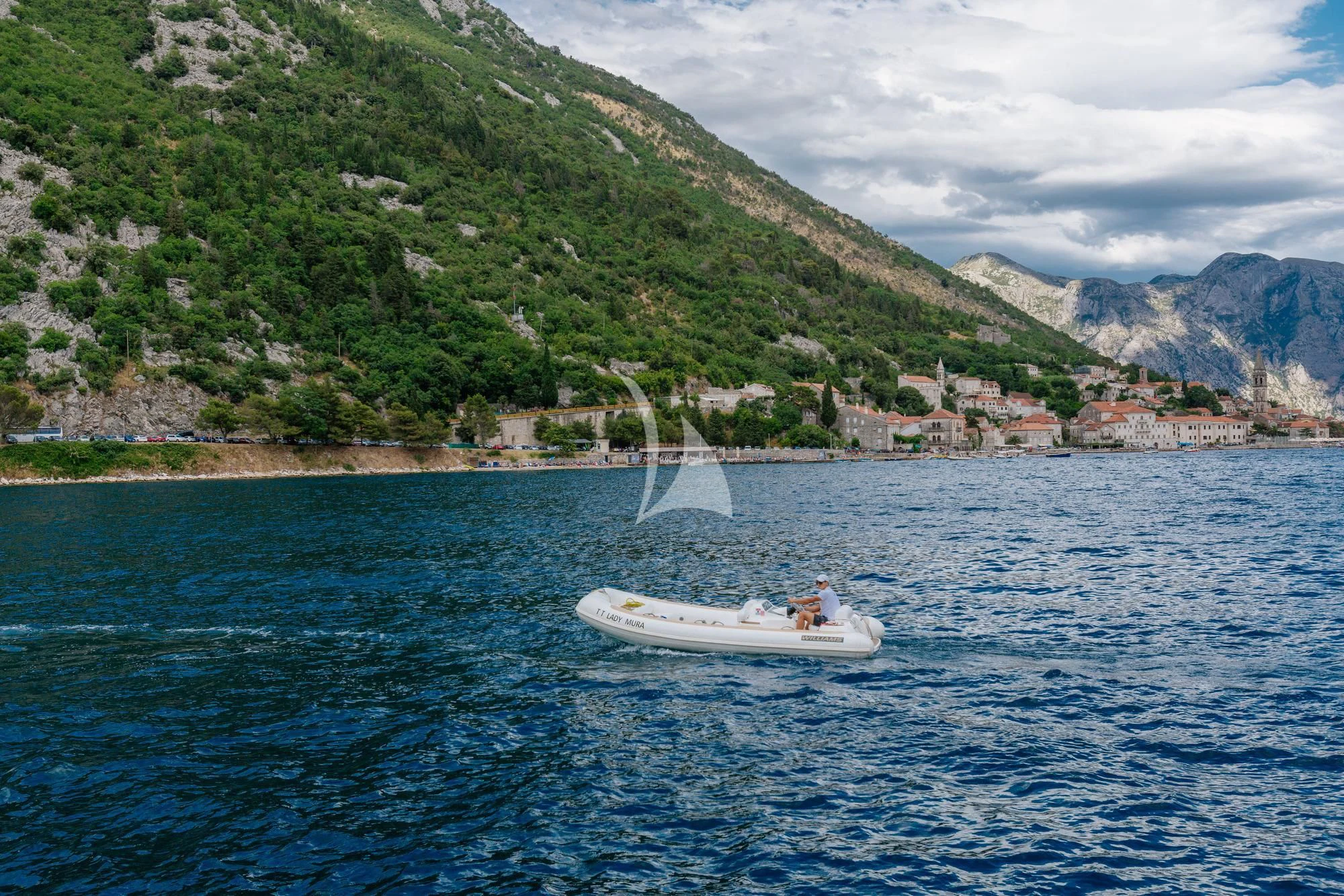 a couple people in a boat on the water aboard LADY MURA Yacht for Sale