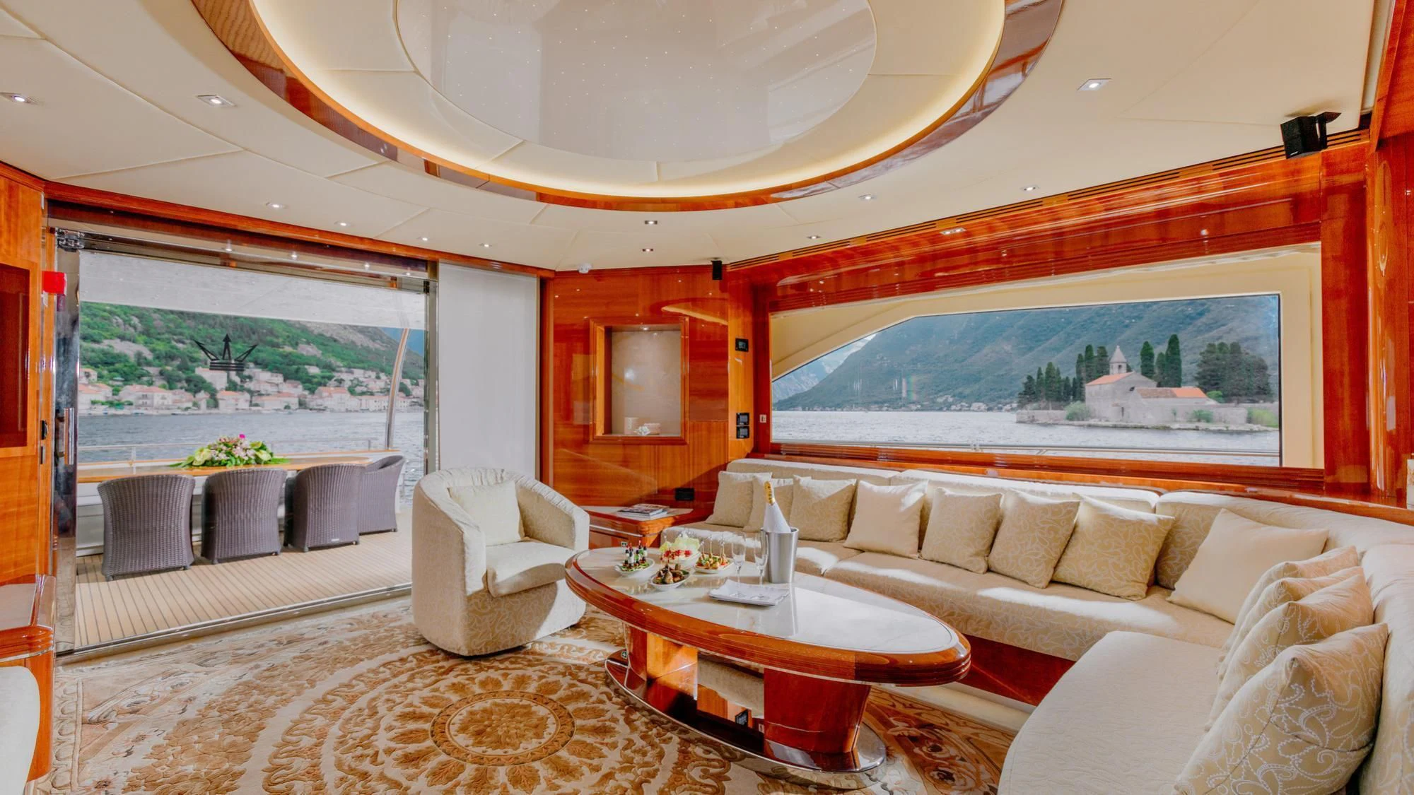 a living room with a large window aboard LADY MURA Yacht for Sale