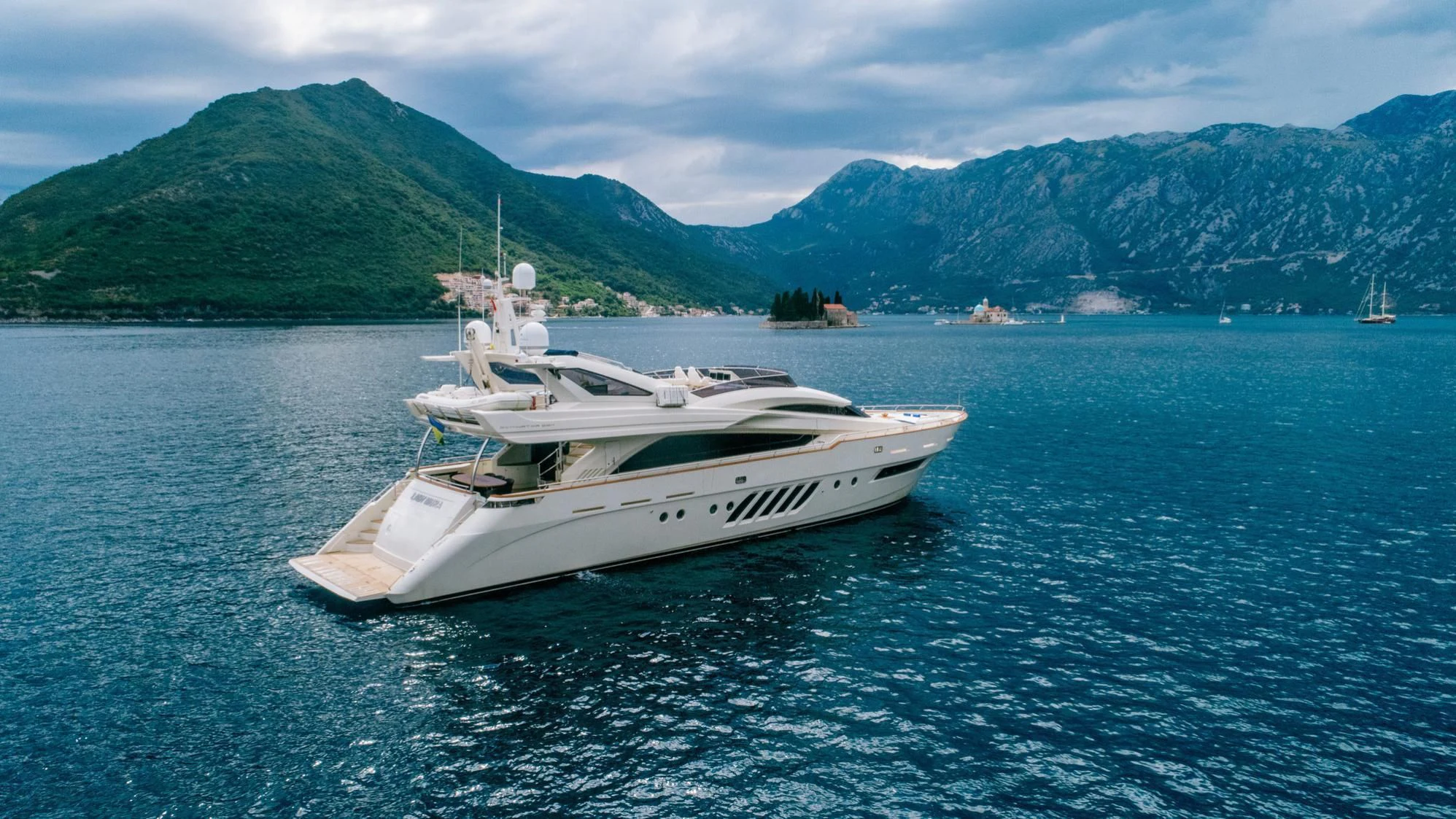 a white boat in the water aboard LADY MURA Yacht for Sale