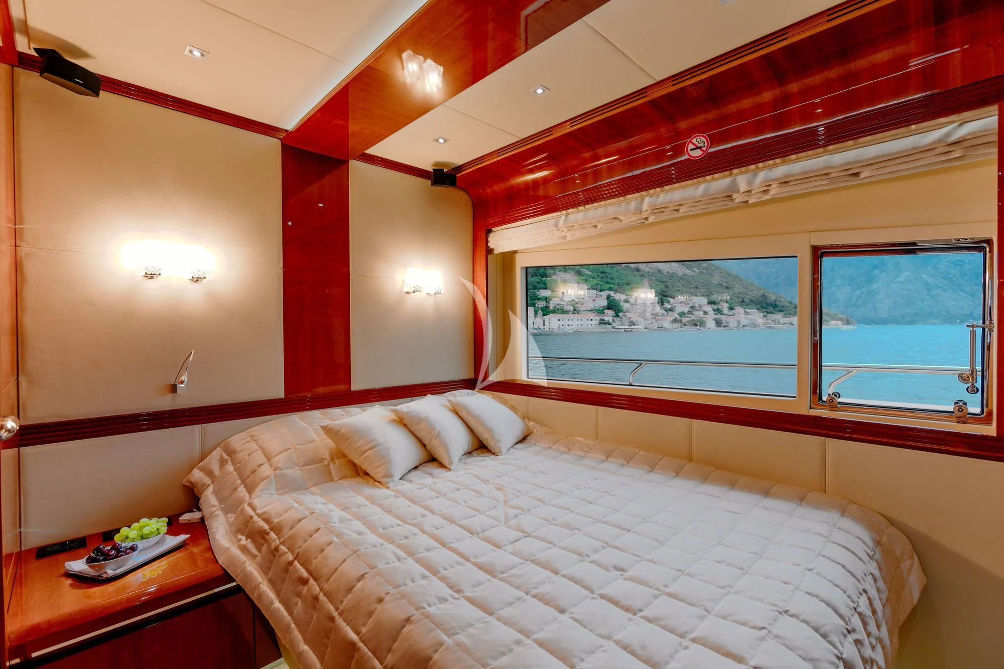 a room with a bed and a window aboard LADY MURA Yacht for Sale
