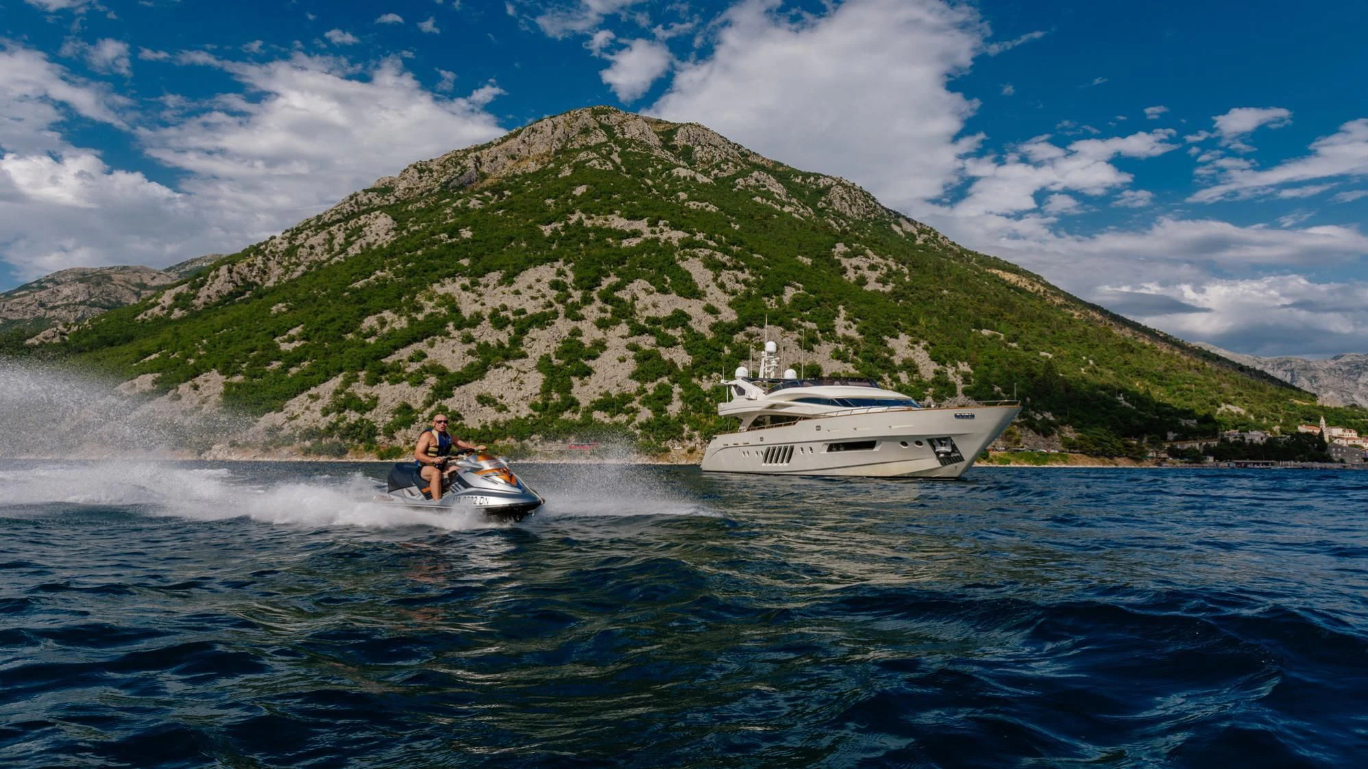 a boat and a person on the water aboard LADY MURA Yacht for Sale