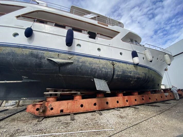 a large boat on a trailer aboard MI AMOR Yacht for Sale