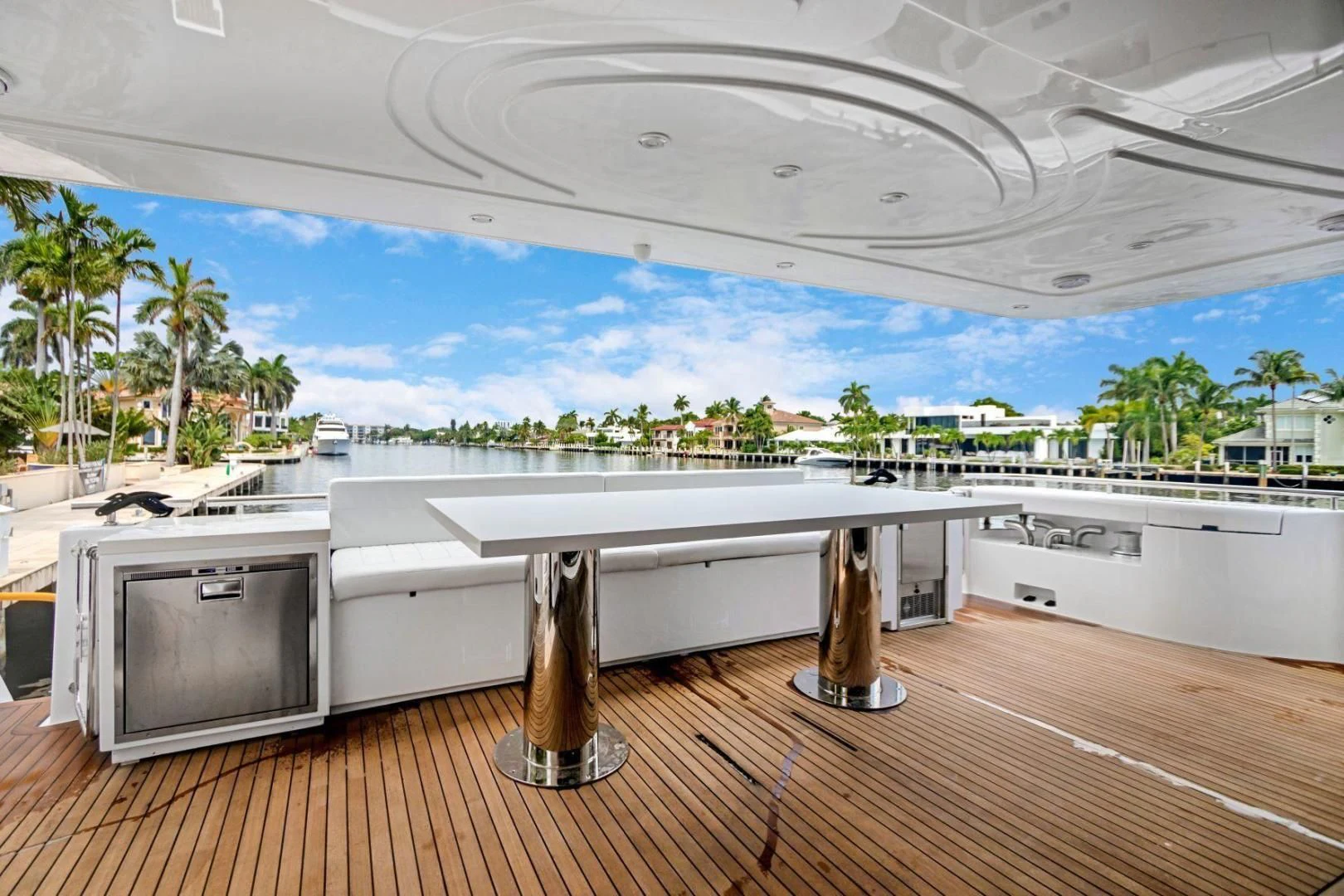 a large room with a balcony and a large pool aboard SINPATICO Yacht for Sale