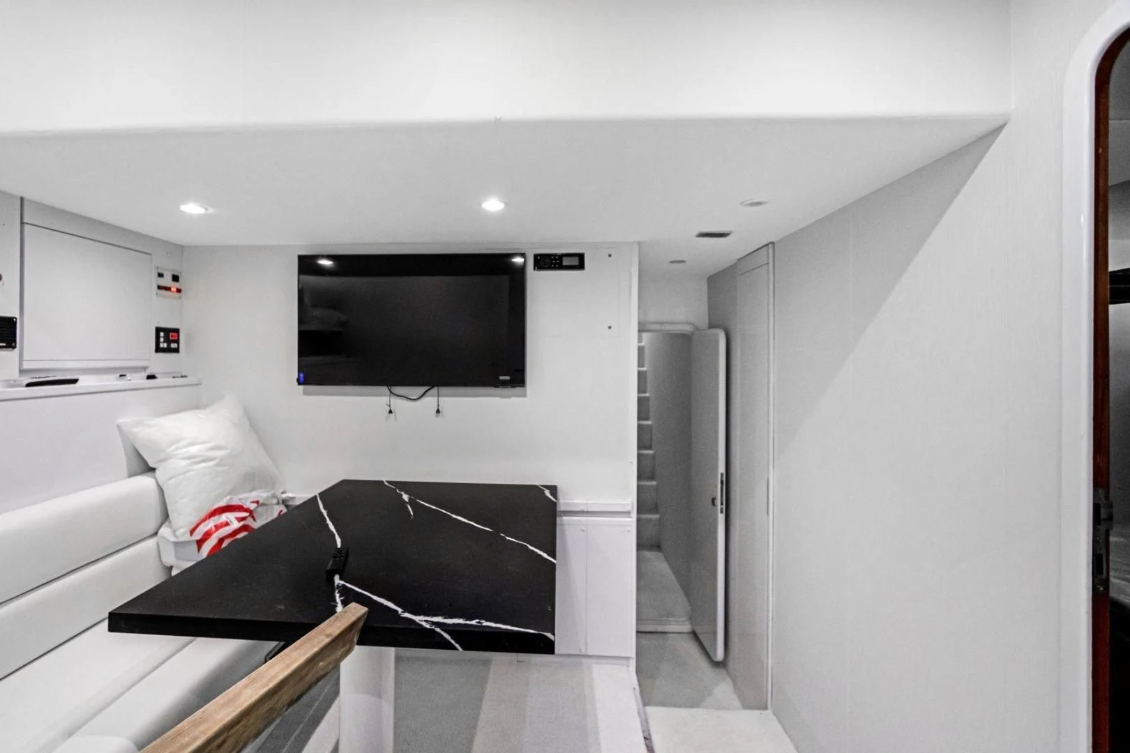 a room with a tv and a couch aboard SINPATICO Yacht for Sale