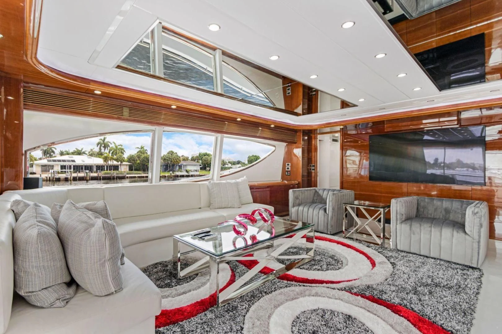 a living room with a large window aboard SINPATICO Yacht for Sale