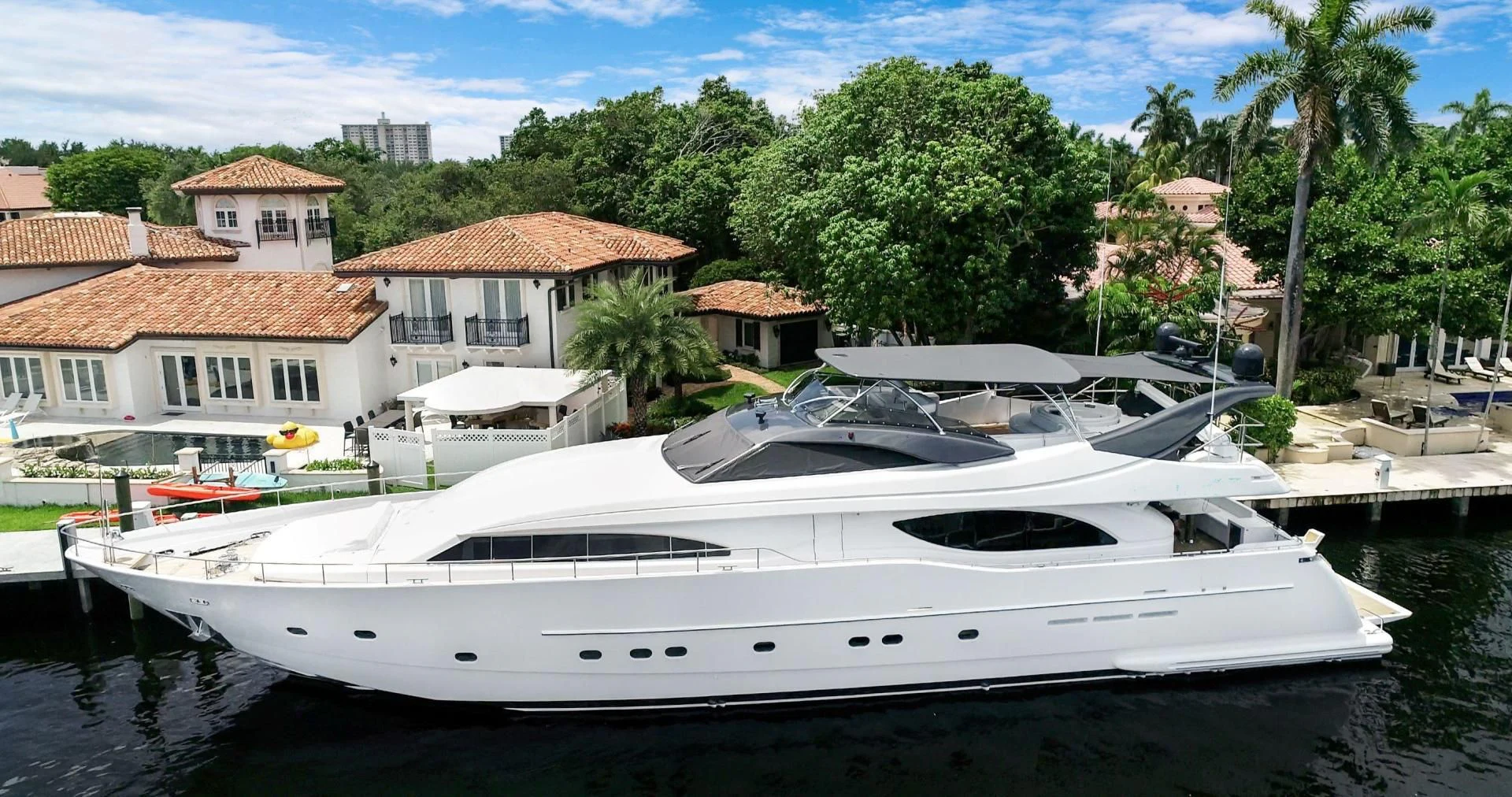 a boat docked in a harbor aboard SINPATICO Yacht for Sale