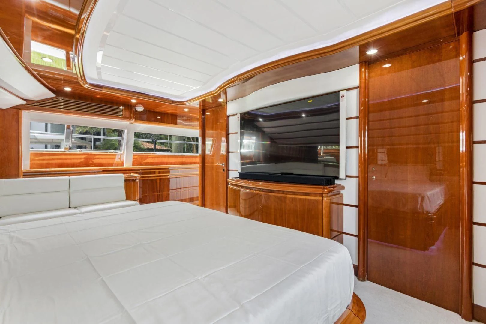 a room with a bed and a closet aboard SINPATICO Yacht for Sale