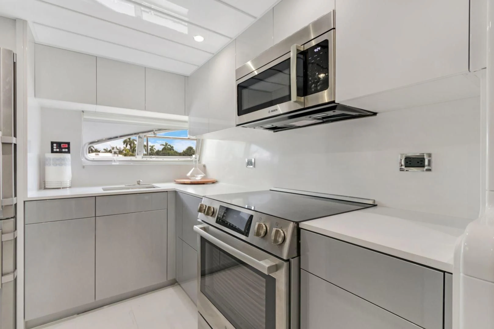 a kitchen with white cabinets aboard SINPATICO Yacht for Sale