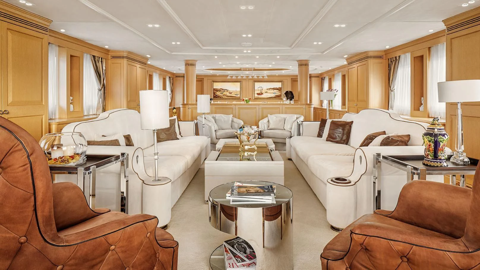 a living room with a couch and a coffee table aboard VERA Yacht for Sale