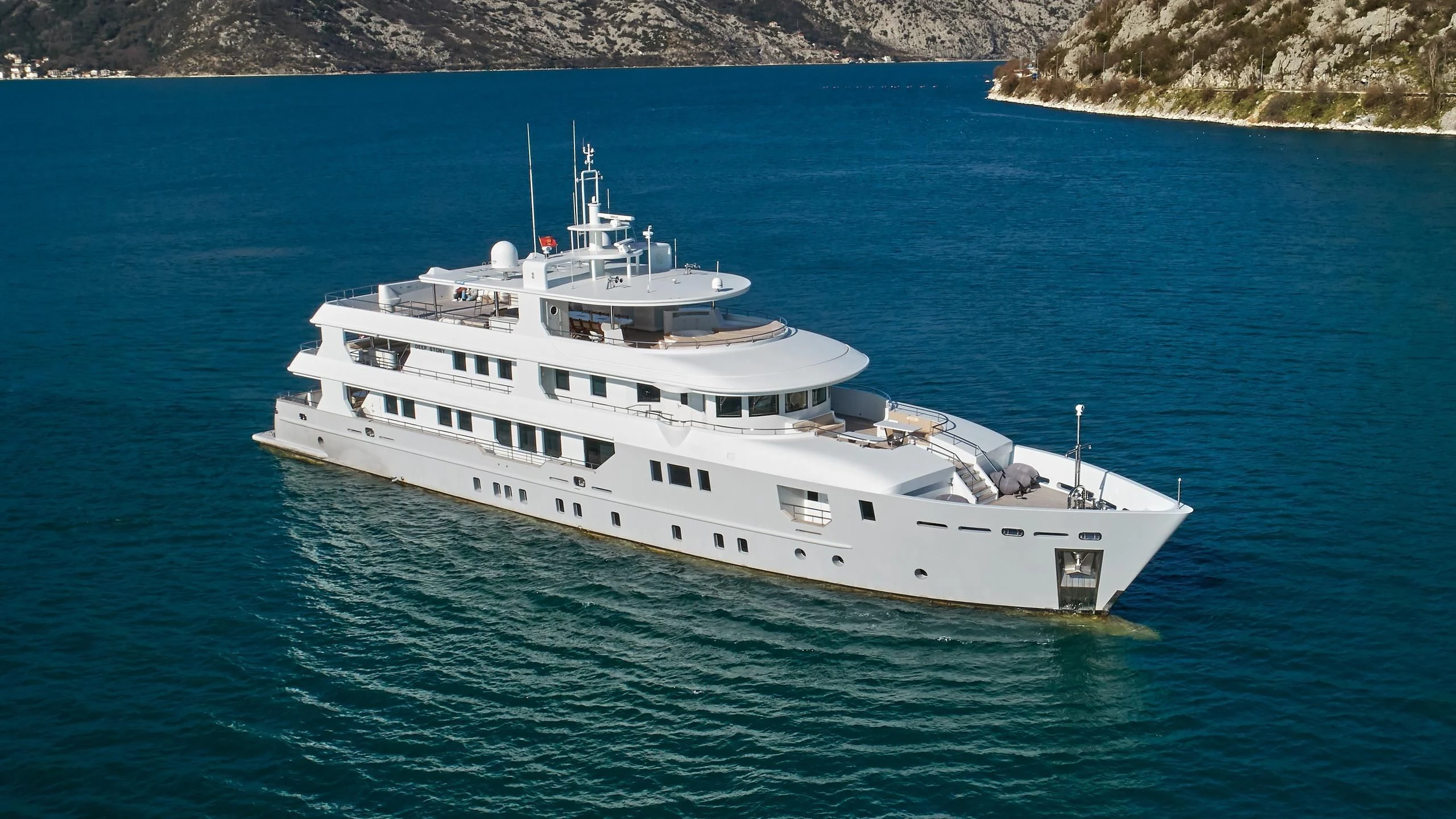 a white yacht in the water aboard VERA Yacht for Sale