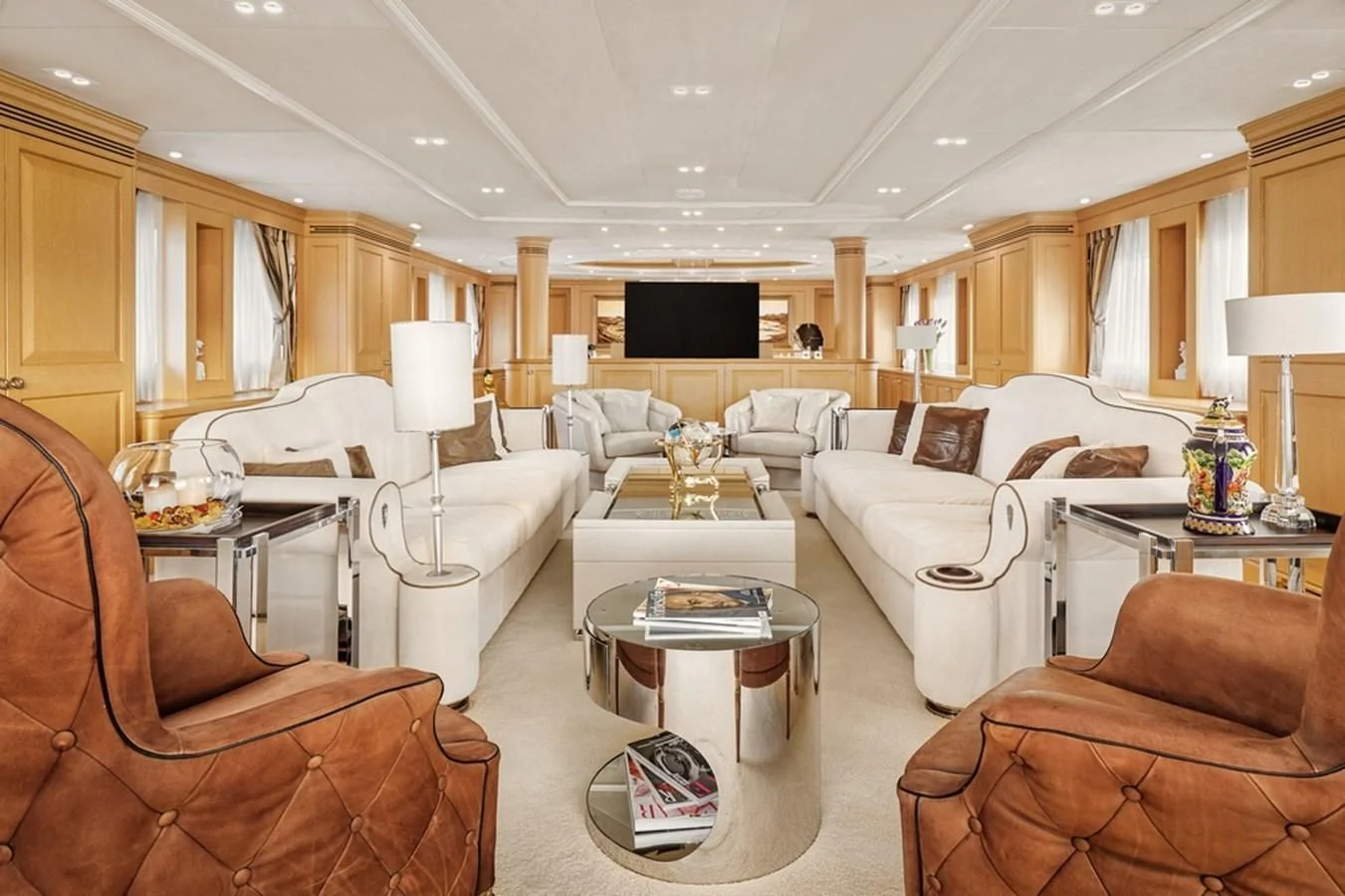 a living room with a couch and a coffee table aboard VERA Yacht for Sale