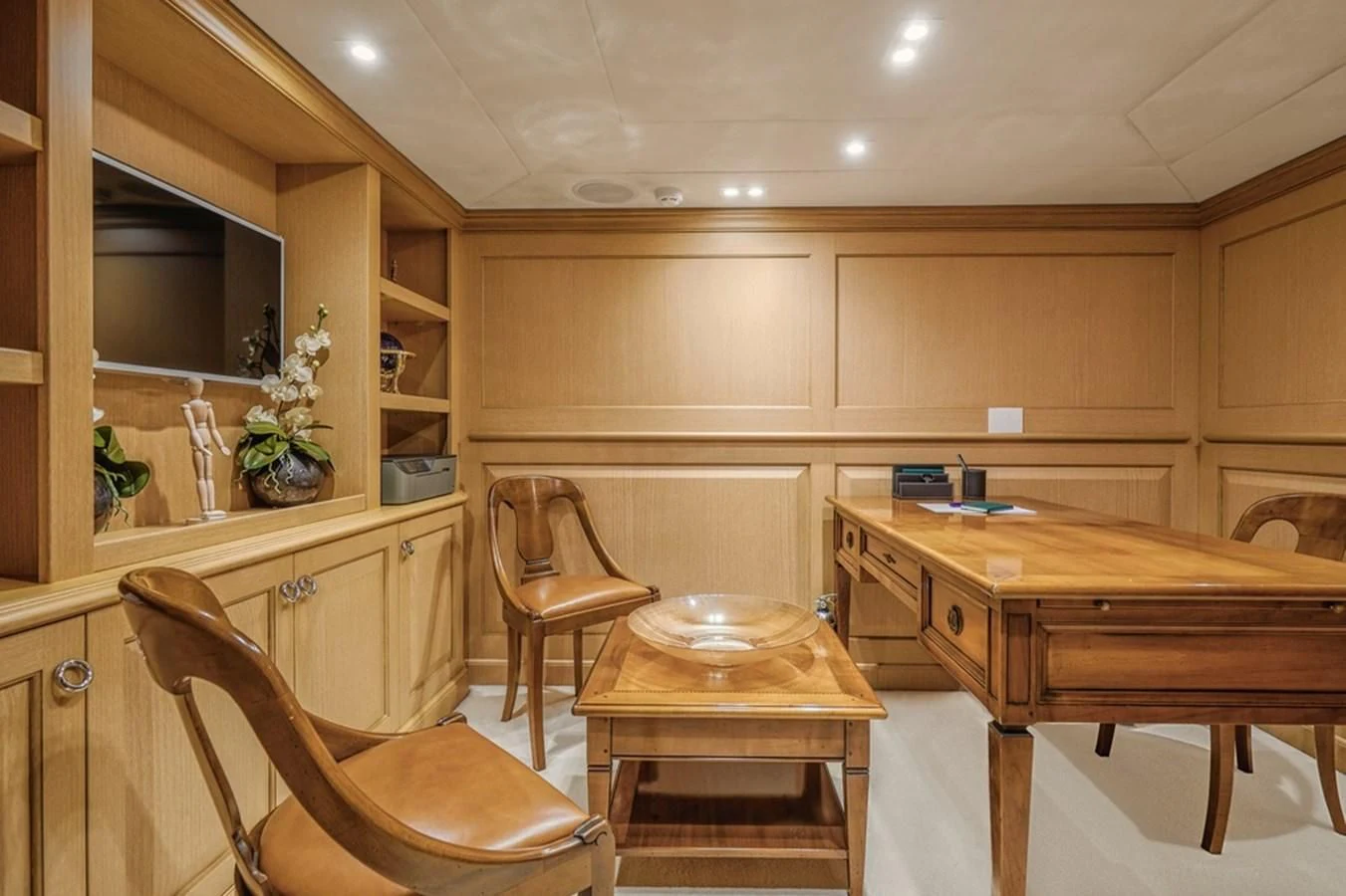 a kitchen with a table and chairs aboard VERA Yacht for Sale
