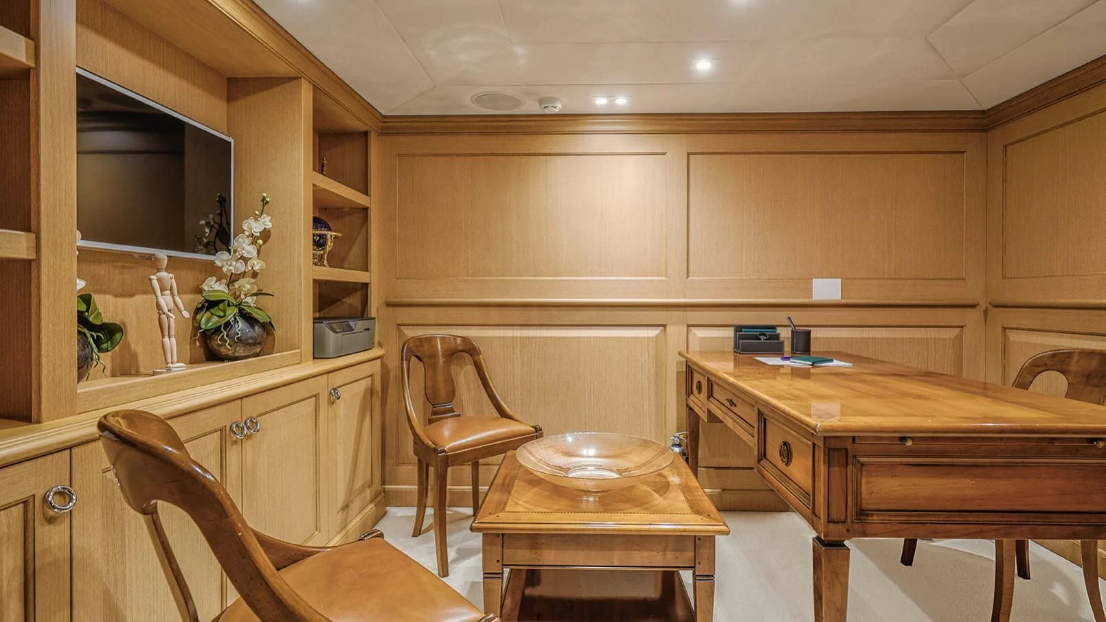 a kitchen with a table and chairs aboard VERA Yacht for Sale
