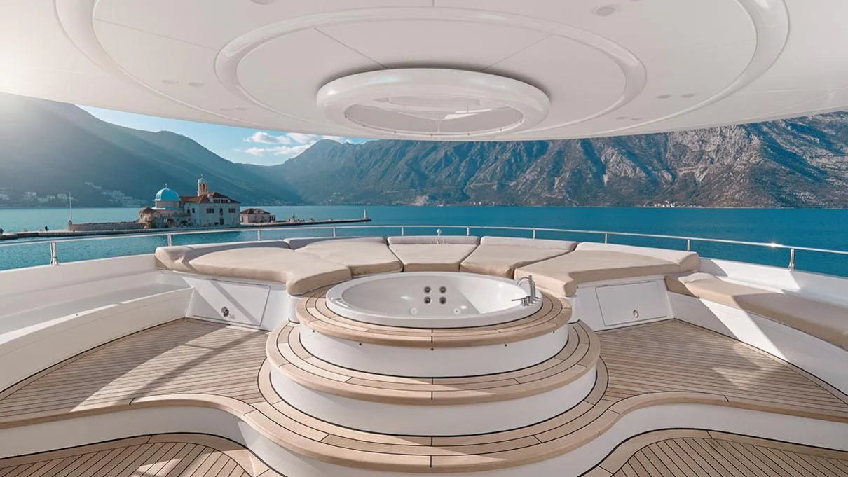 a large white bathtub with a round sink in the middle of a room with a view of aboard VERA Yacht for Sale