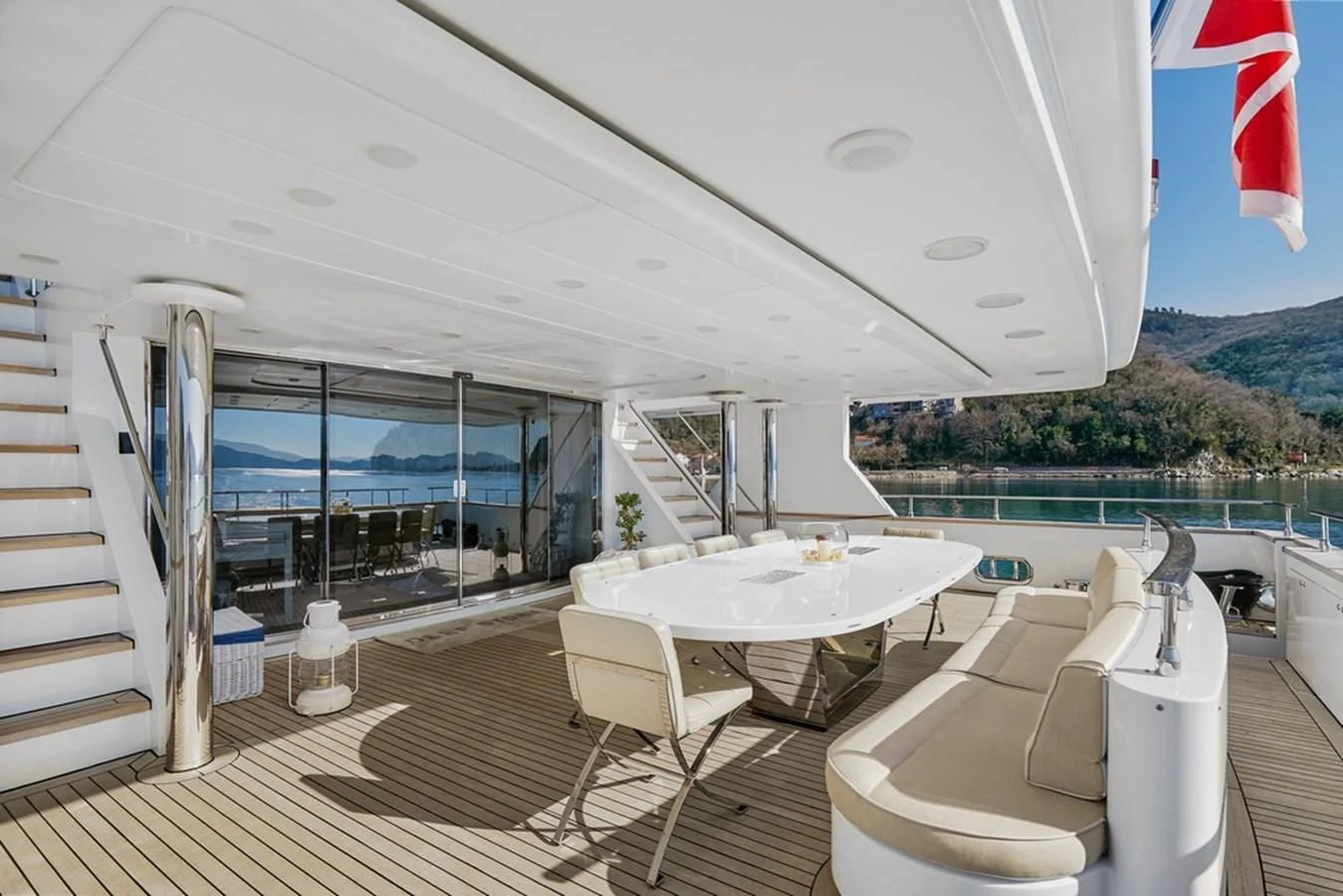 a room with a table and chairs aboard VERA Yacht for Sale