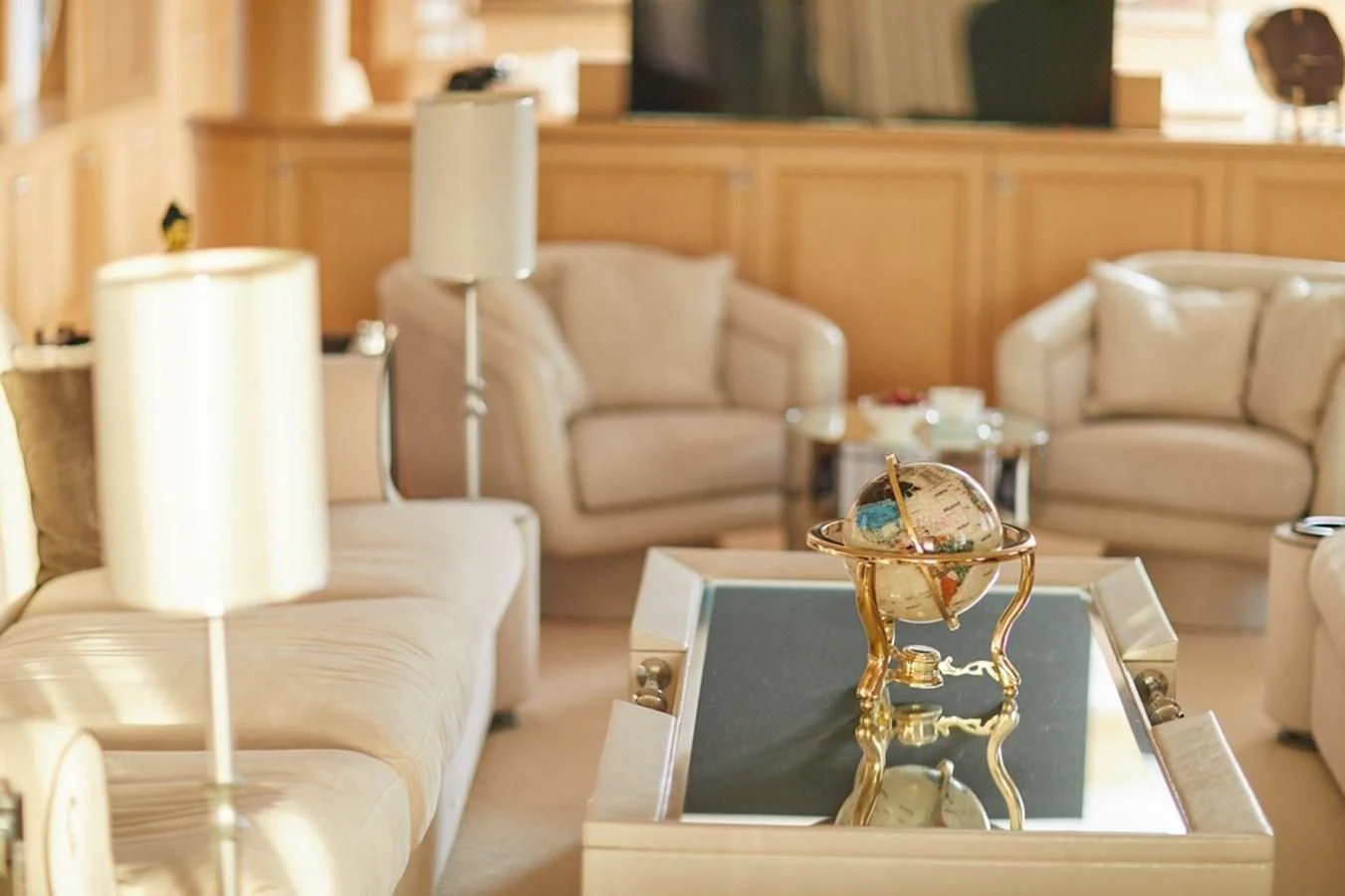 a room with a couch and a coffee table aboard VERA Yacht for Sale