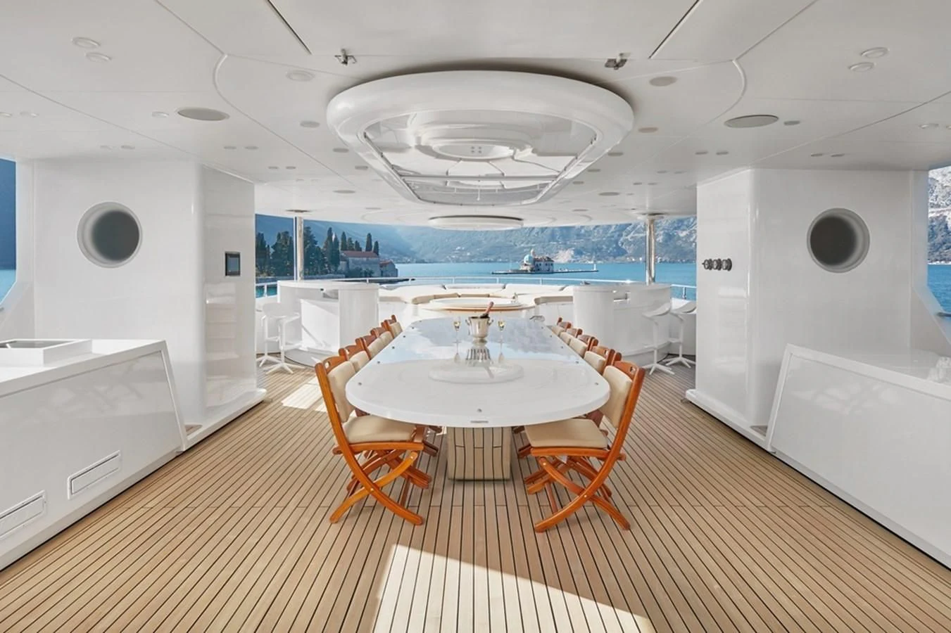 a large room with a table and chairs aboard VERA Yacht for Sale
