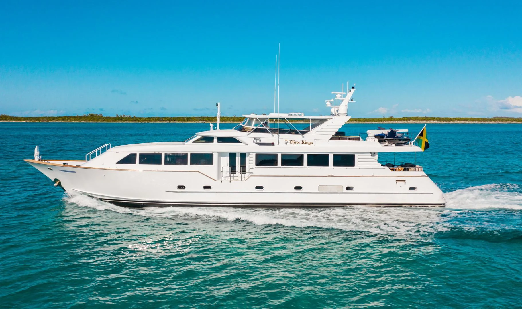 a white boat in the water aboard THREE KINGS Yacht for Sale