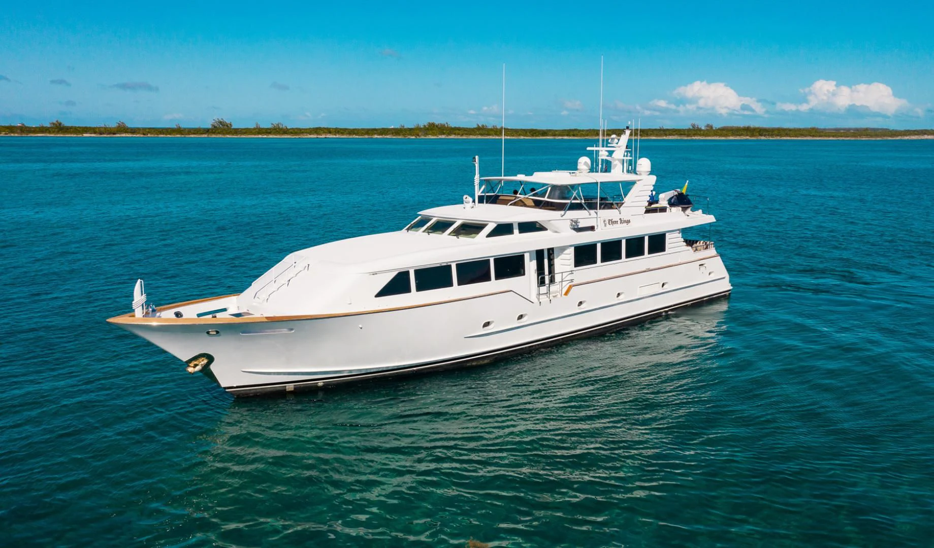 a white yacht in the water aboard THREE KINGS Yacht for Sale