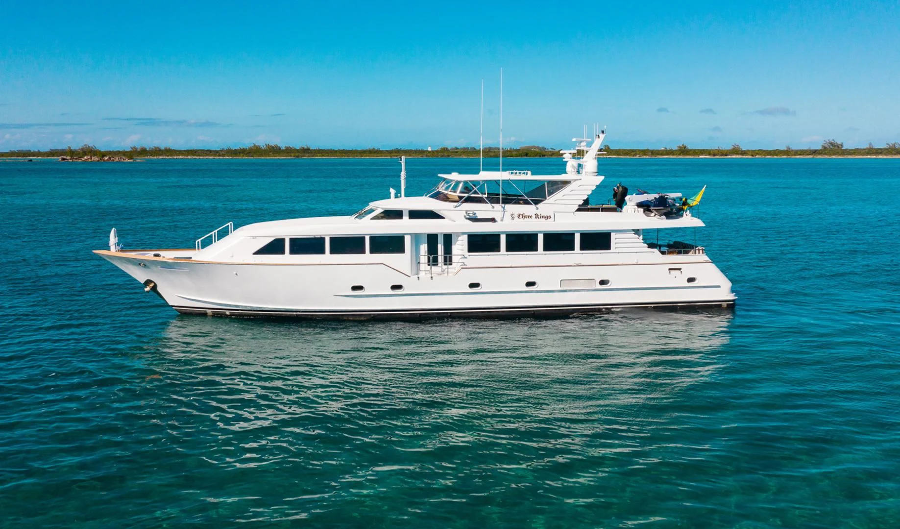 a white boat in the water aboard THREE KINGS Yacht for Sale