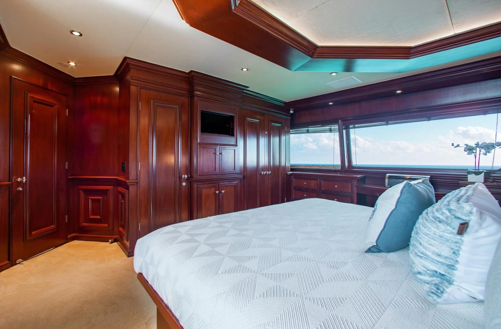a bed in a room aboard THREE KINGS Yacht for Sale