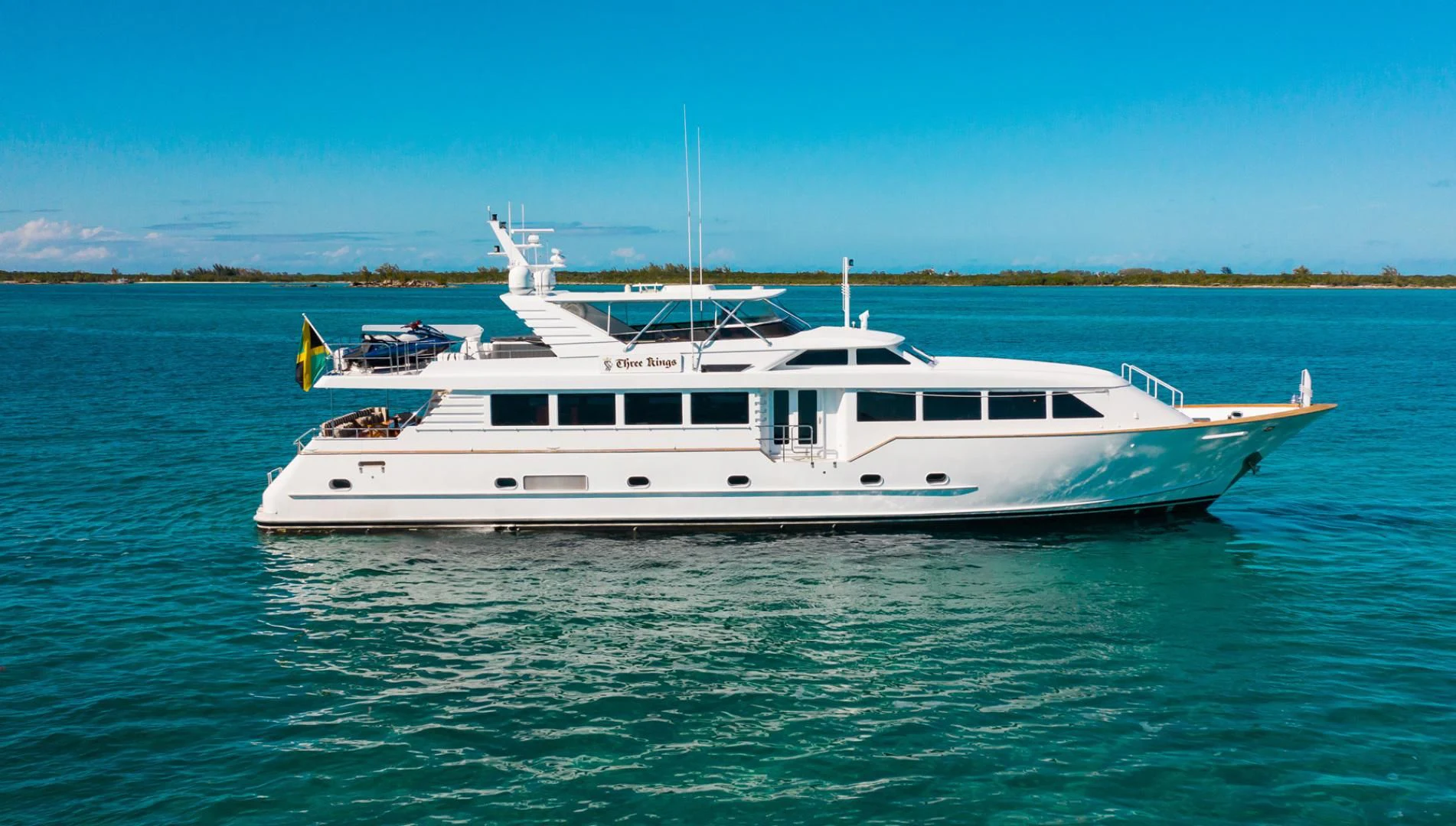 a white boat in the water aboard THREE KINGS Yacht for Sale