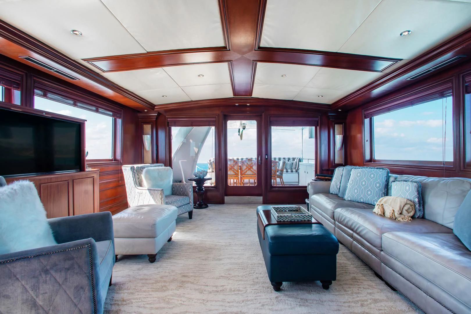 a living room with a large open window aboard THREE KINGS Yacht for Sale