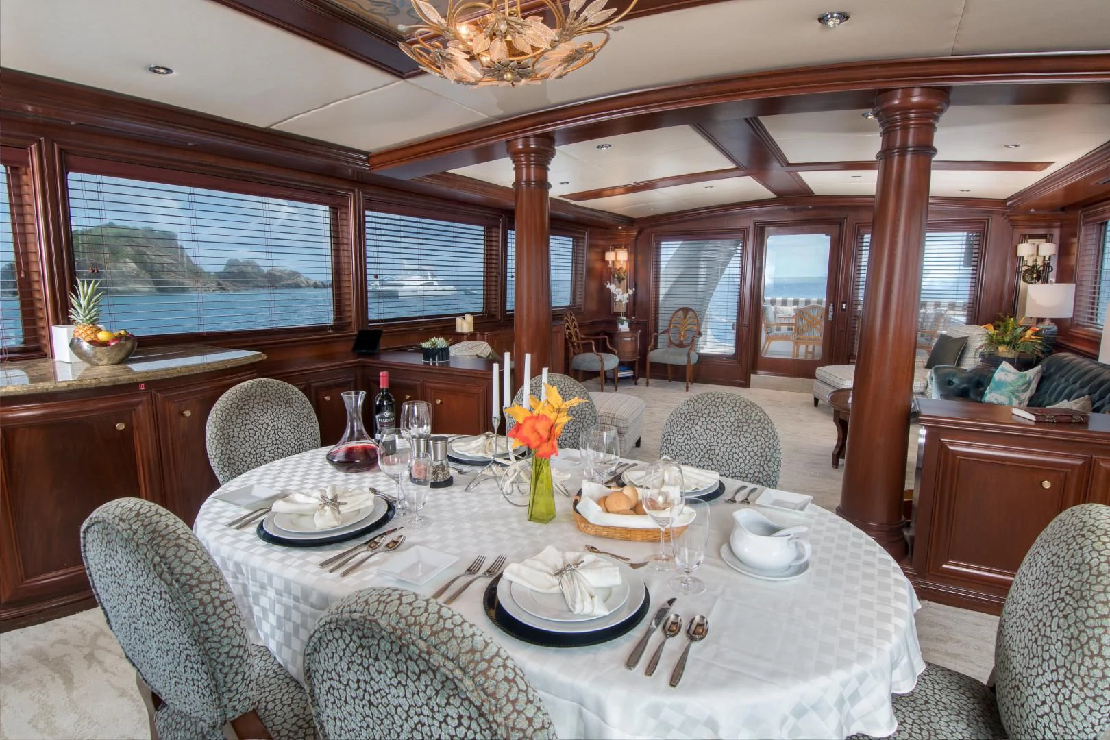 a dining room with a table set aboard THREE KINGS Yacht for Sale