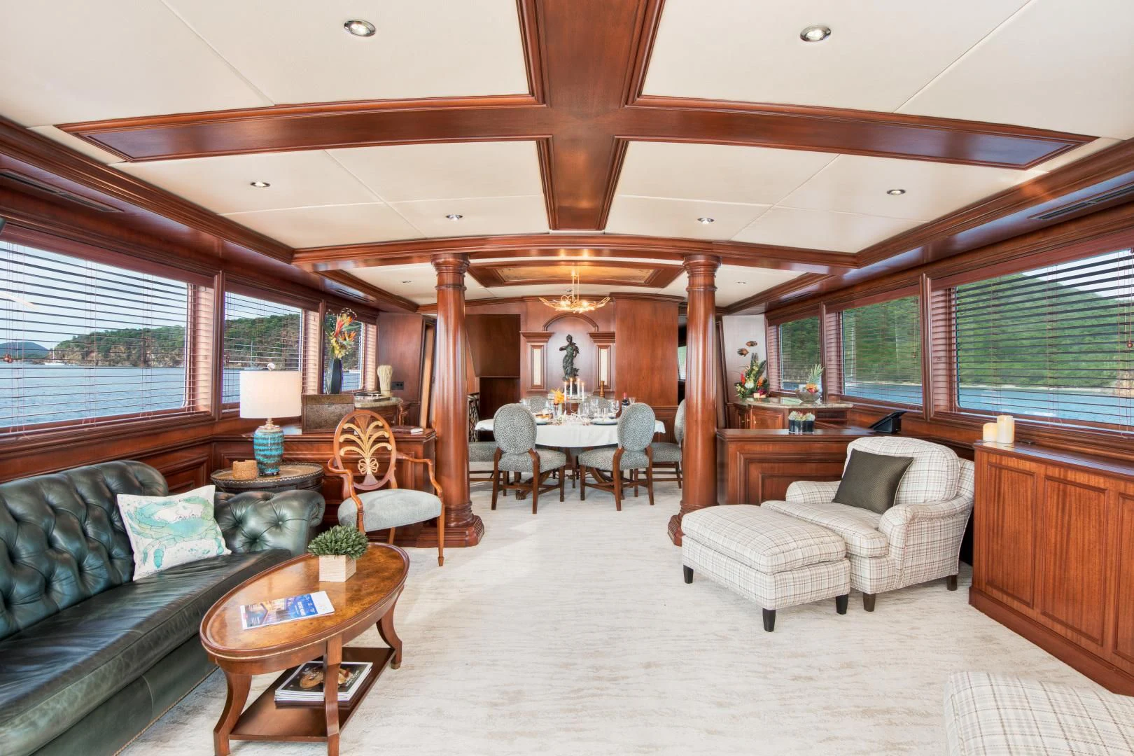 a living room with a couch and a table aboard THREE KINGS Yacht for Sale