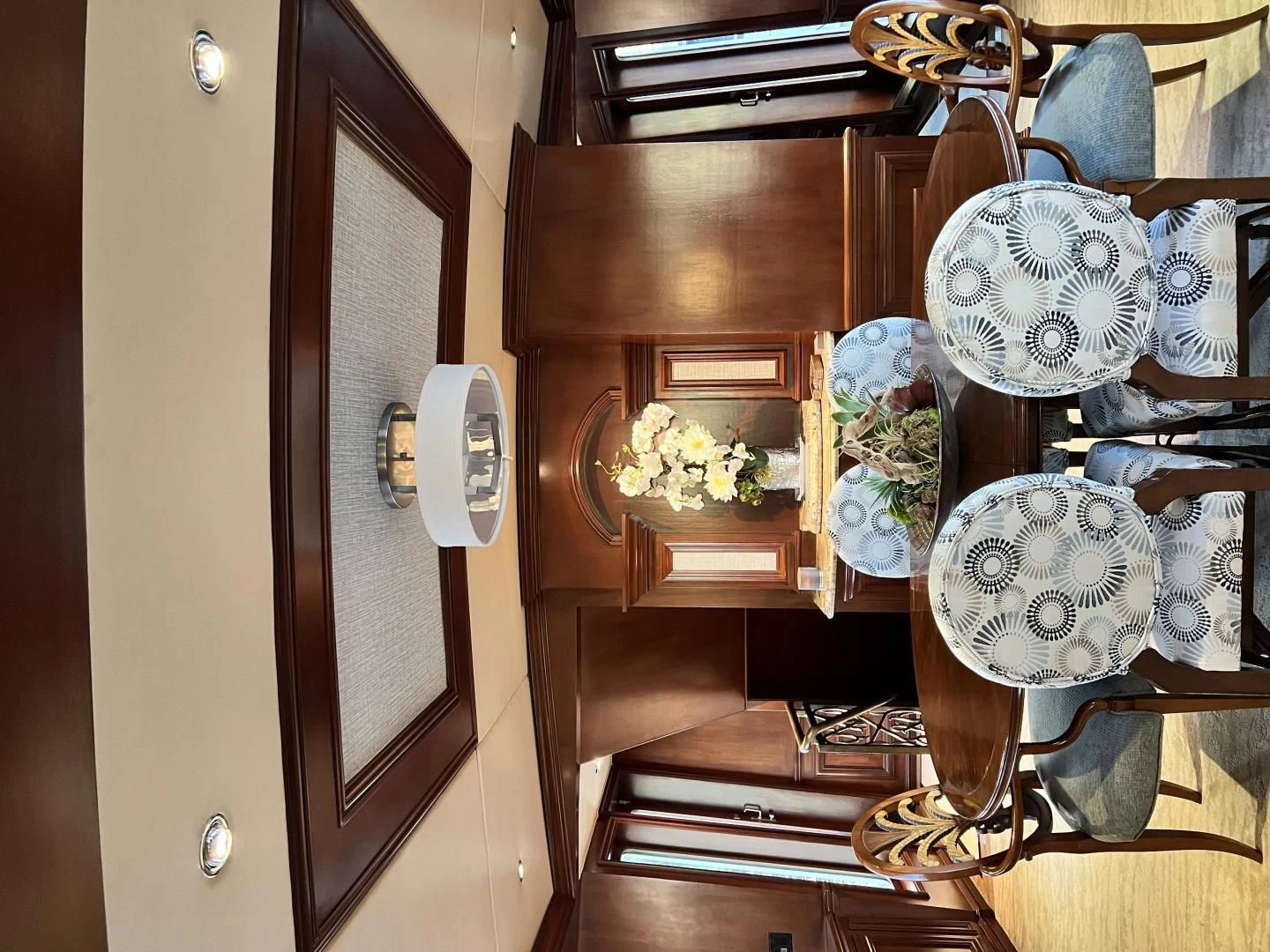 a room with a mirror and a shelf with objects on it aboard THREE KINGS Yacht for Sale