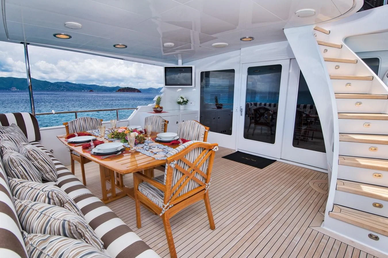 a room with a table and chairs aboard THREE KINGS Yacht for Sale