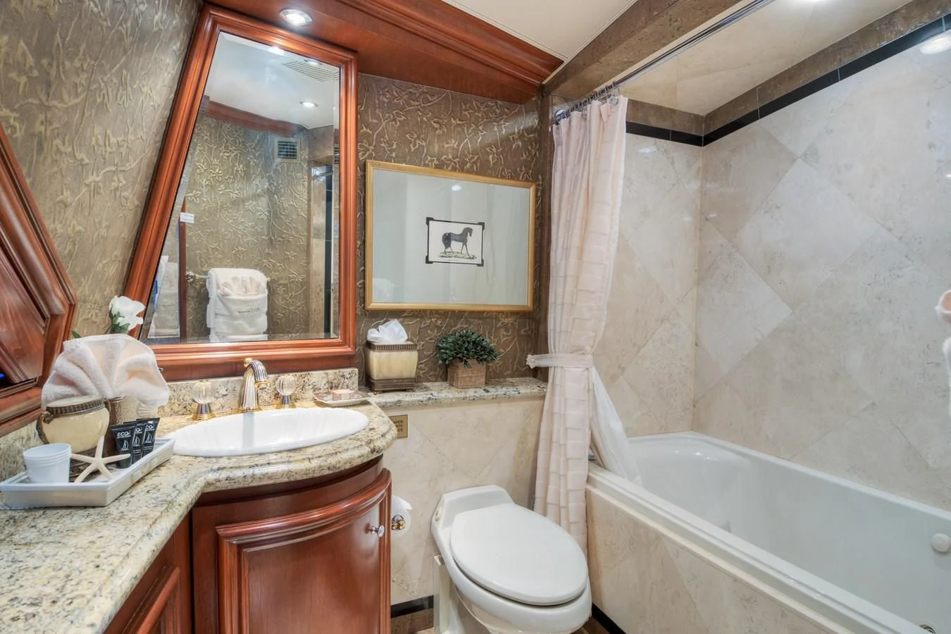 a bathroom with a sink toilet and bathtub aboard THREE KINGS Yacht for Sale