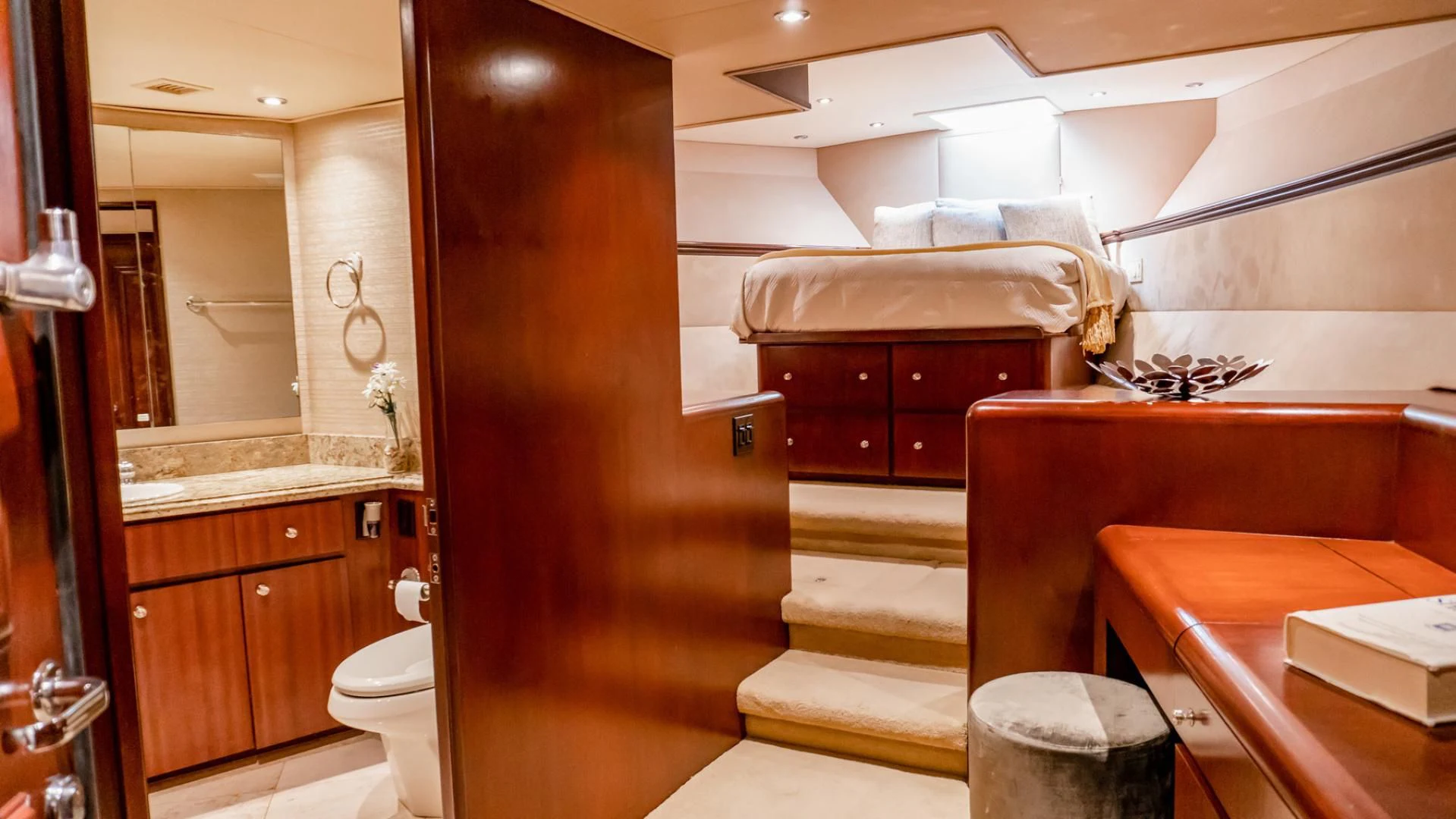 a bathroom with a bed and a desk aboard THREE KINGS Yacht for Sale