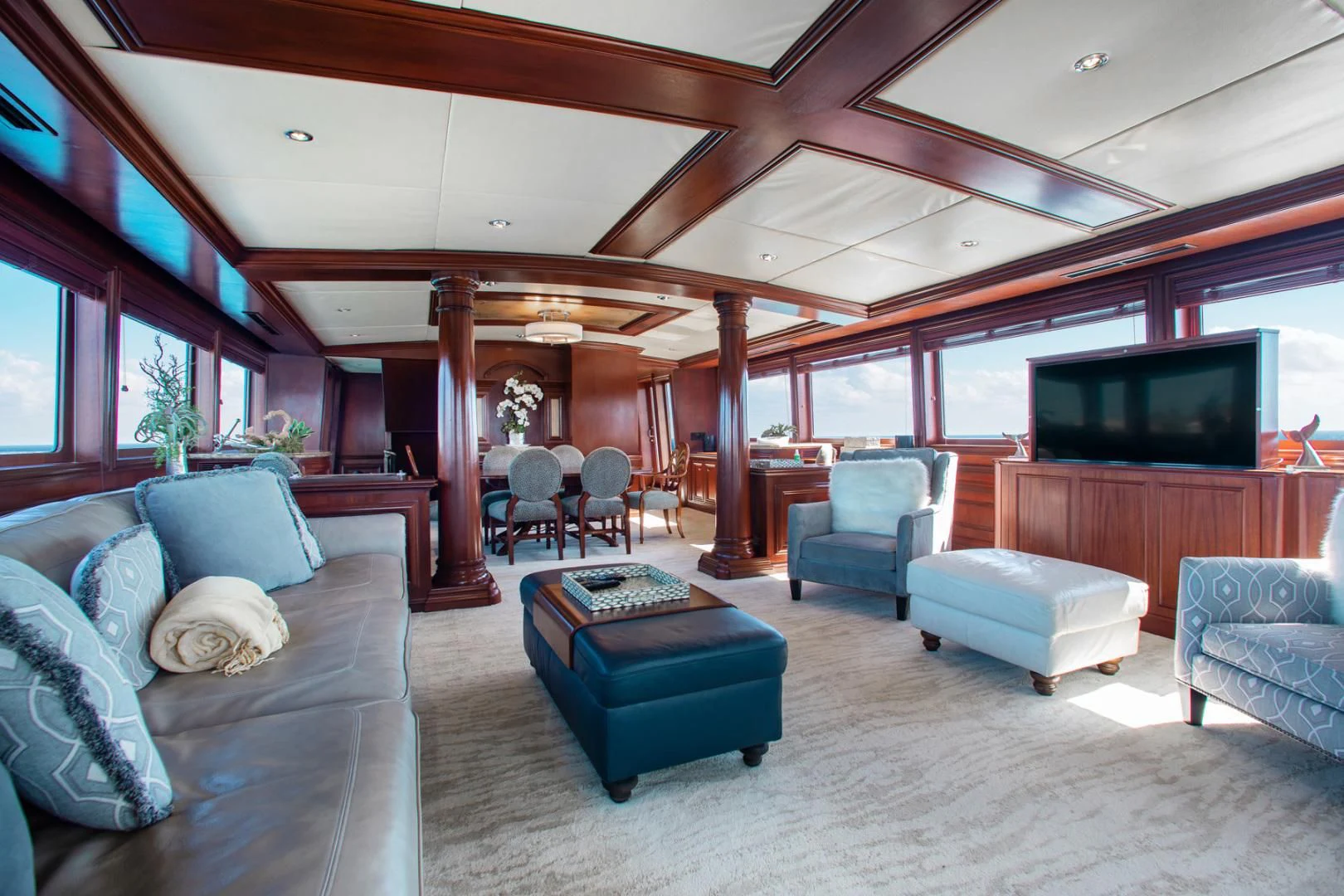 a living room with a large window aboard THREE KINGS Yacht for Sale