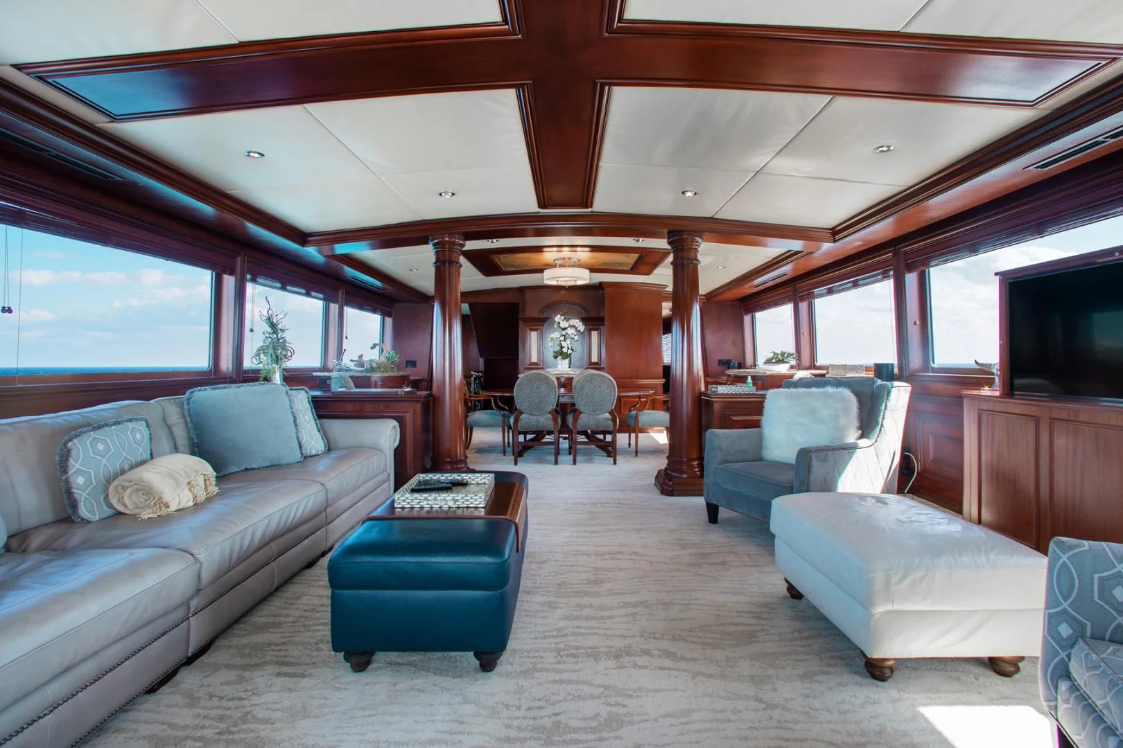 a living room with a couch and a table aboard THREE KINGS Yacht for Sale