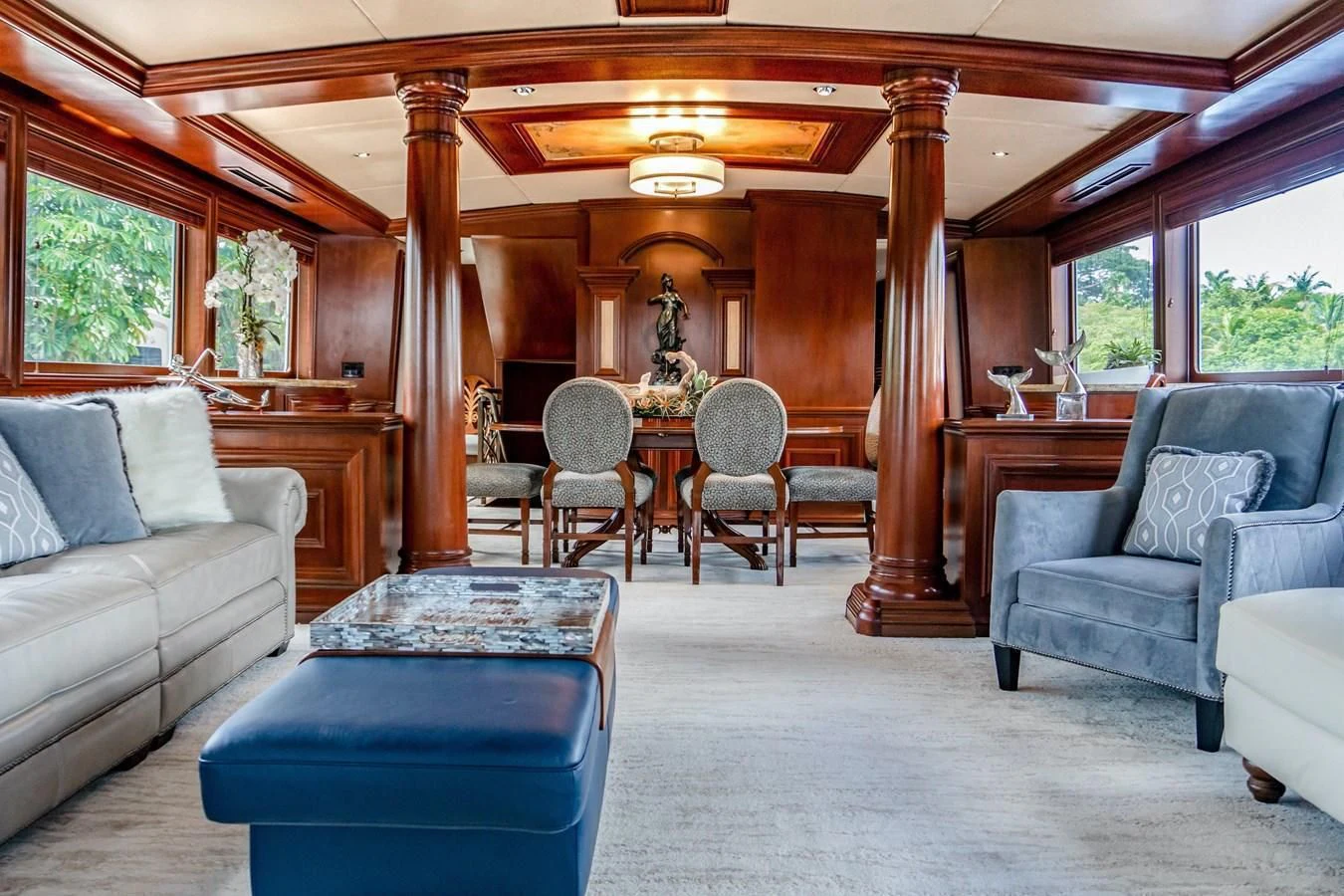 a living room with a table and chairs aboard THREE KINGS Yacht for Sale